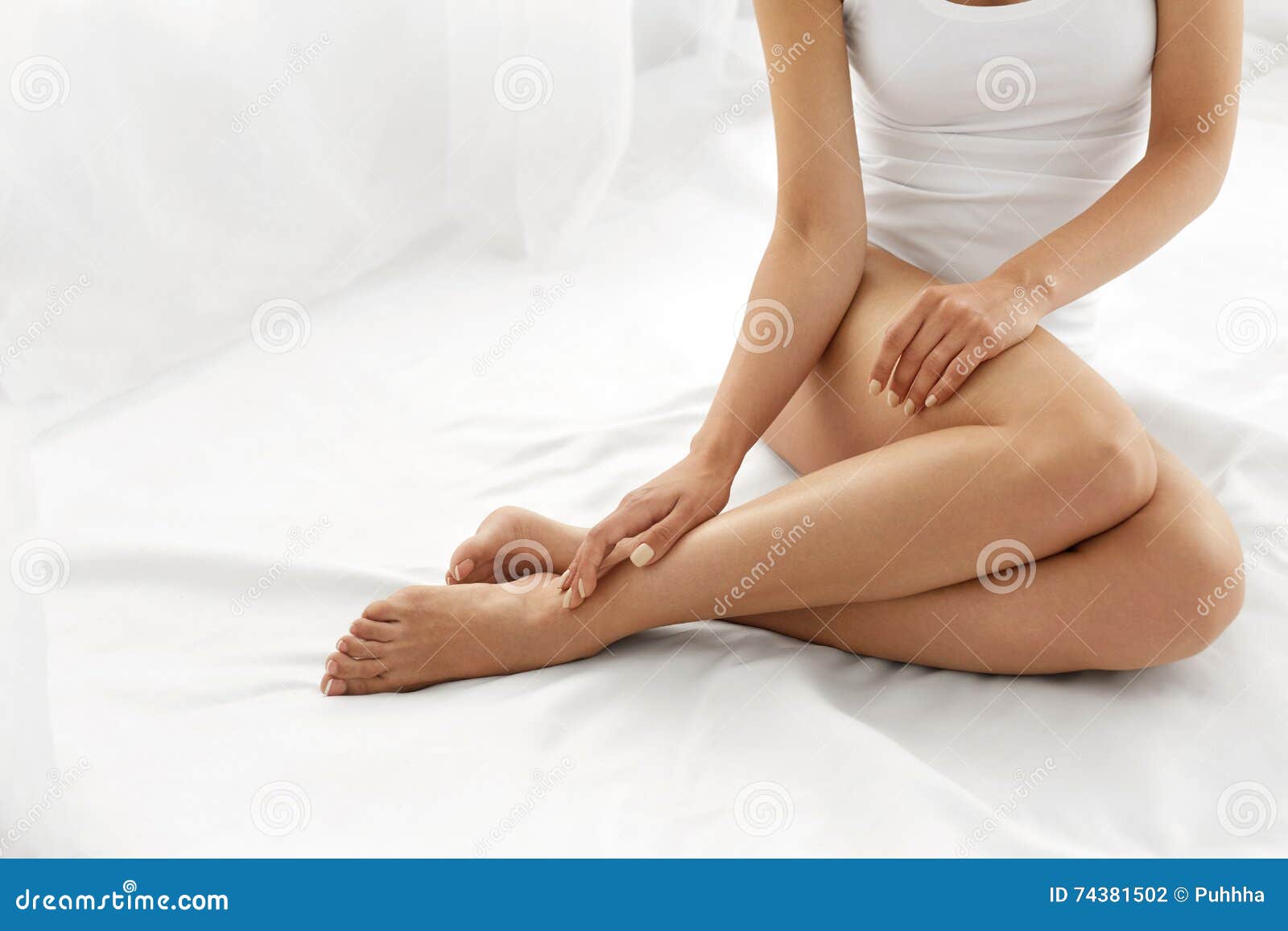 hair removal. close up woman hands touching long legs, soft skin
