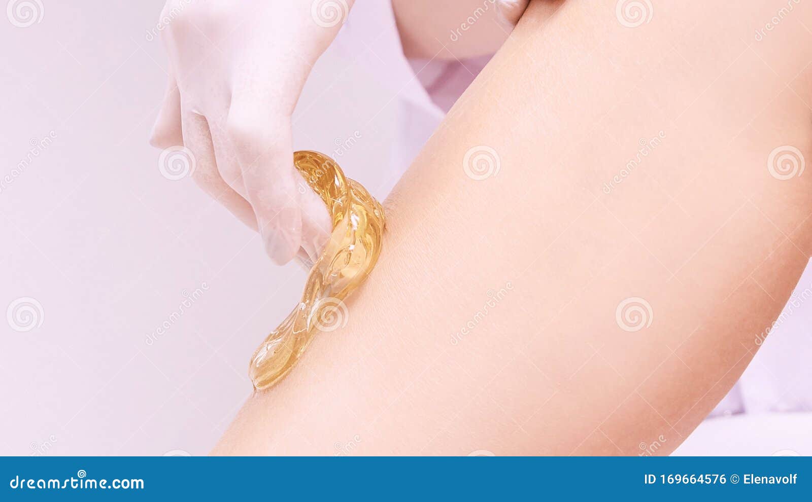 hair removal at spa luxury studio. woman legs wax with shugaring. hot sugar