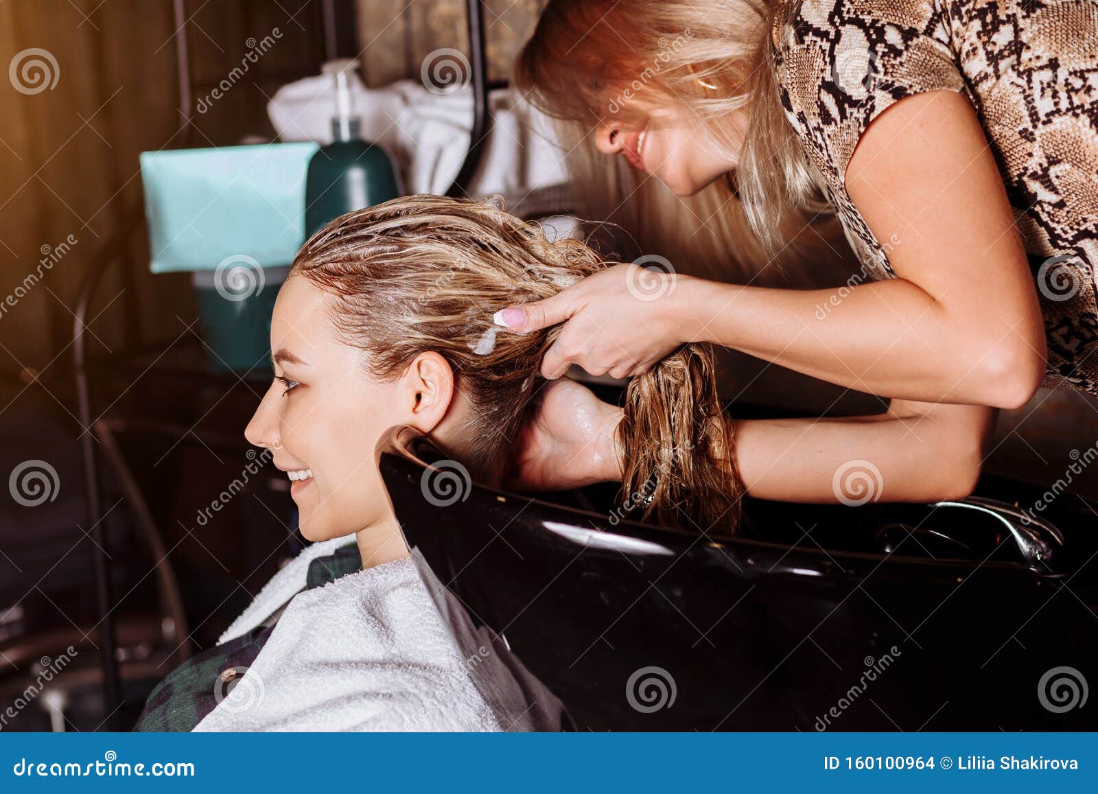 Beautiful Woman Washing Hair In A Hair Salon Stock Photo Image