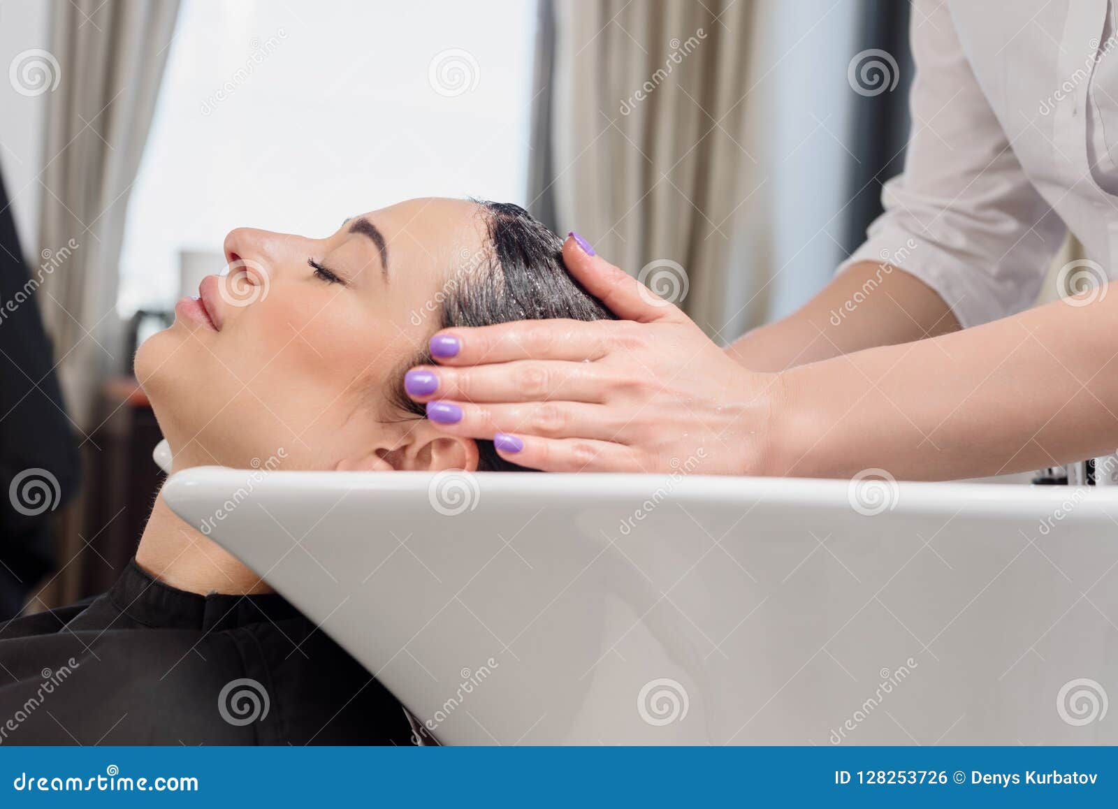 hair wash procedure hairdresser washing her clients professional sink 128253726