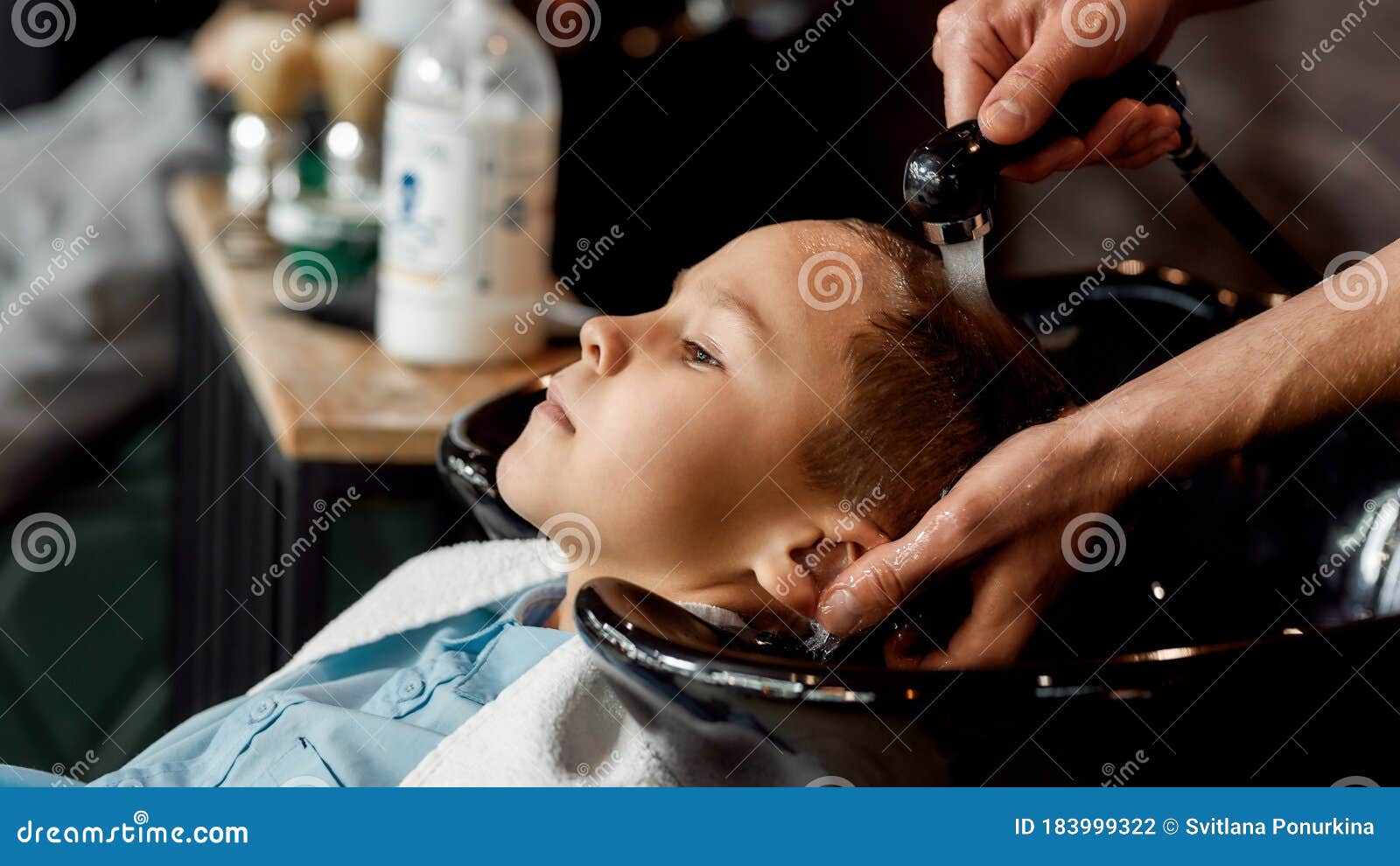 Haircut for Kids. Close Up Photo of a Male Barber Washing Hair of Cute  Little Boy in Barbershop. Kids in Barbershop Stock Photo - Image of  hairdresser, closeup: 183999322