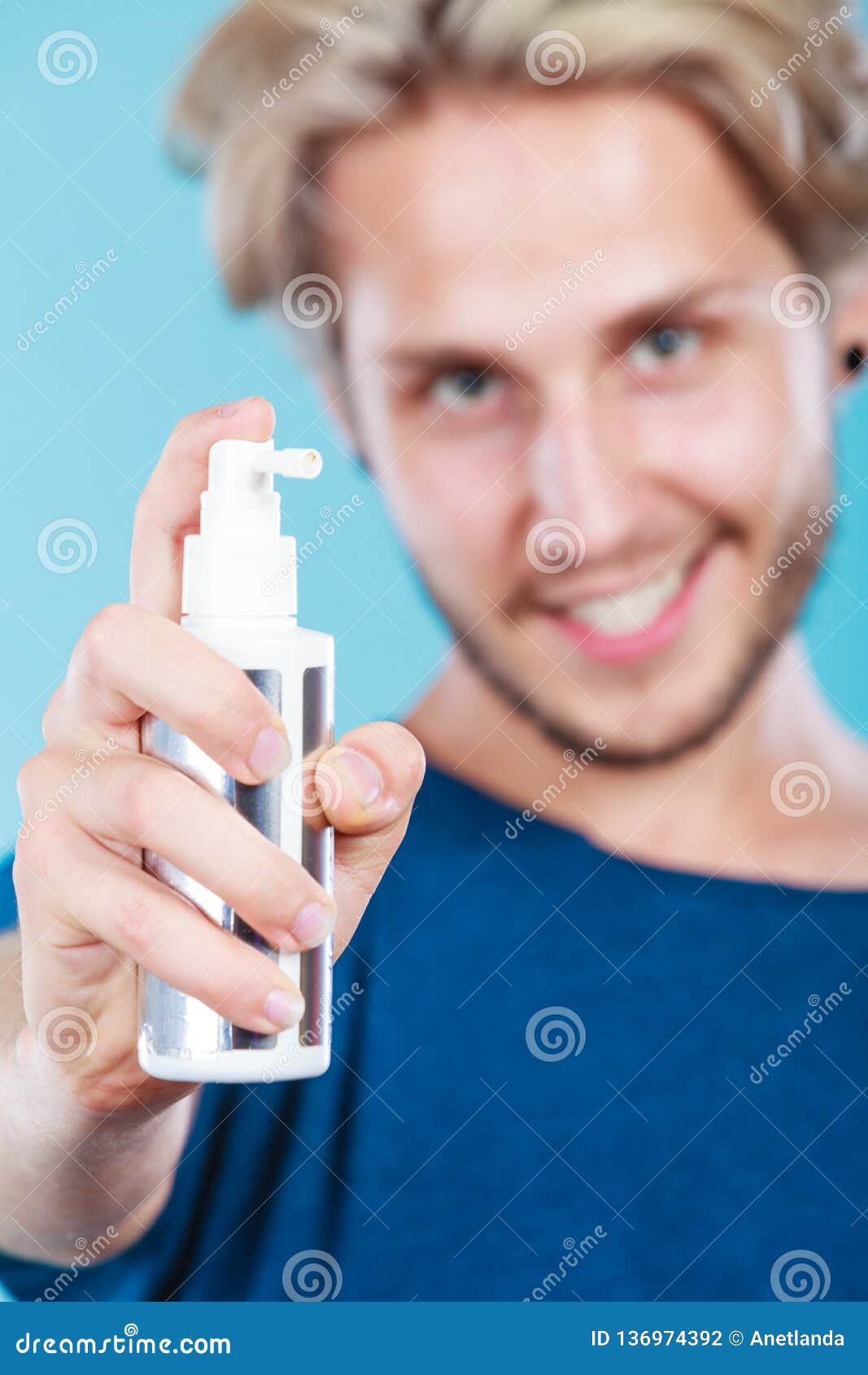 Man Applying Spray Cosmetic To His Hair Stock Photo Image Of Applying Blond