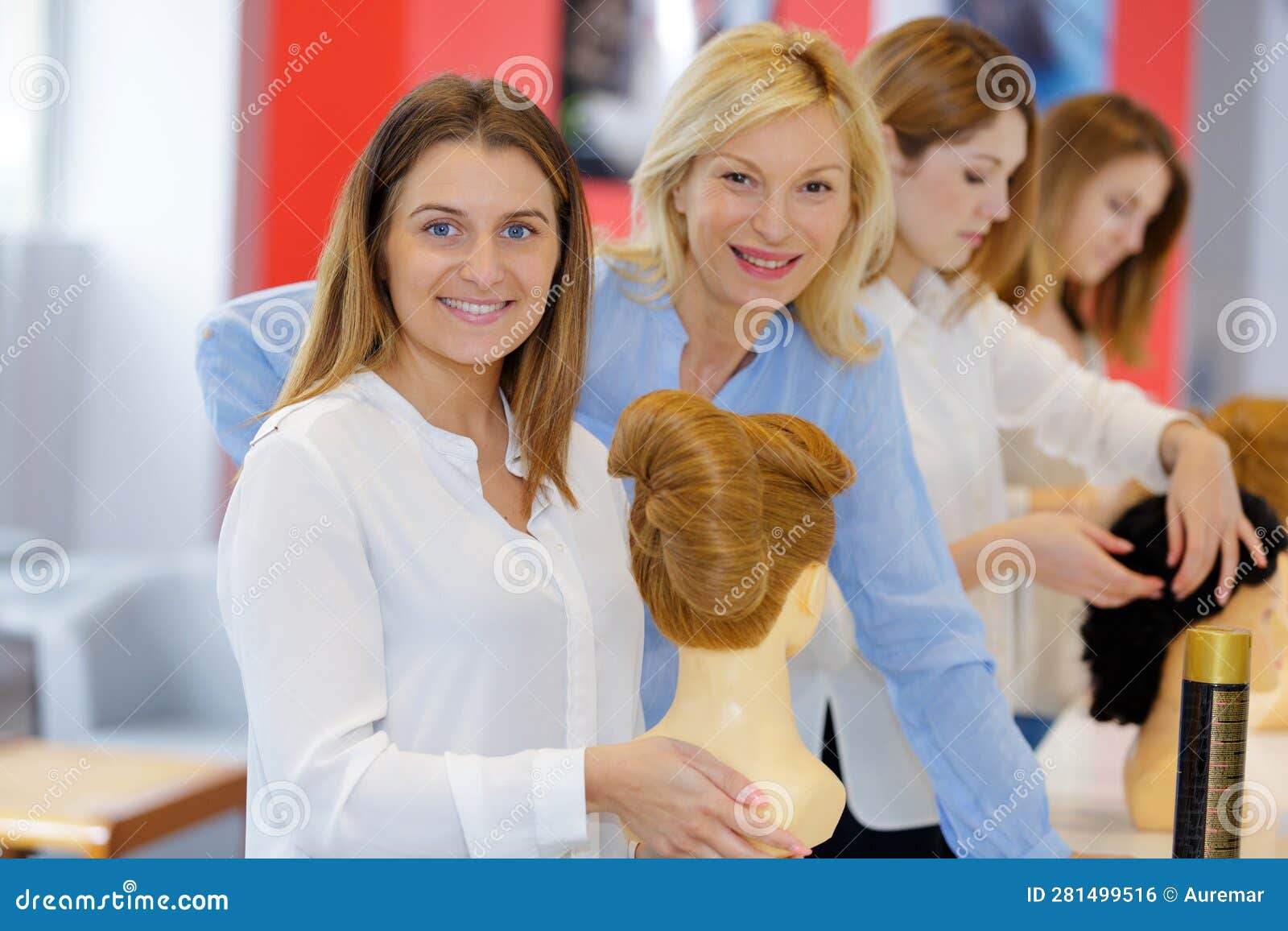 Hairdresser Apprentice Posing and Smiling with Trainer Stock Photo