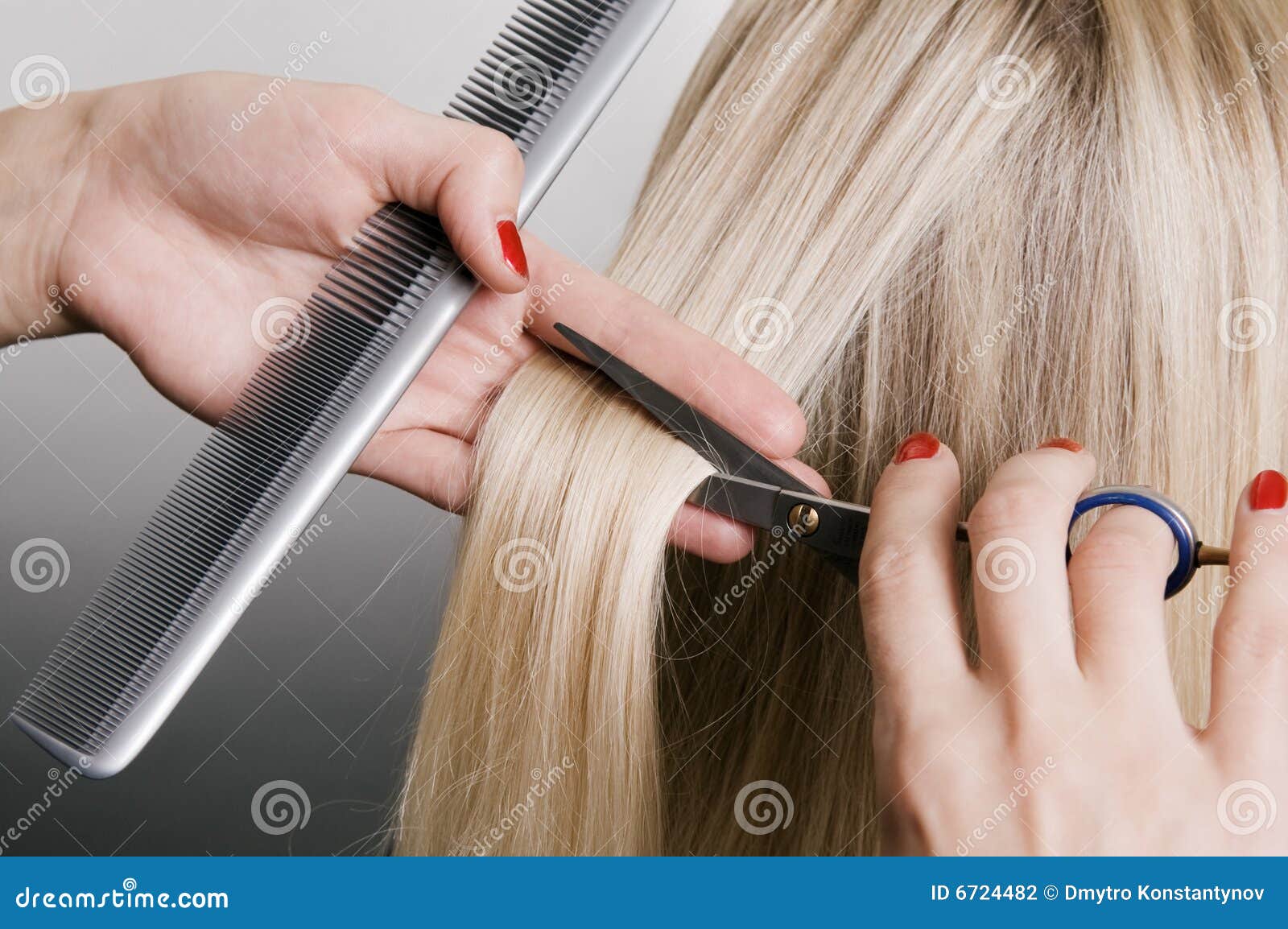 hairdresser cutting blonde hair