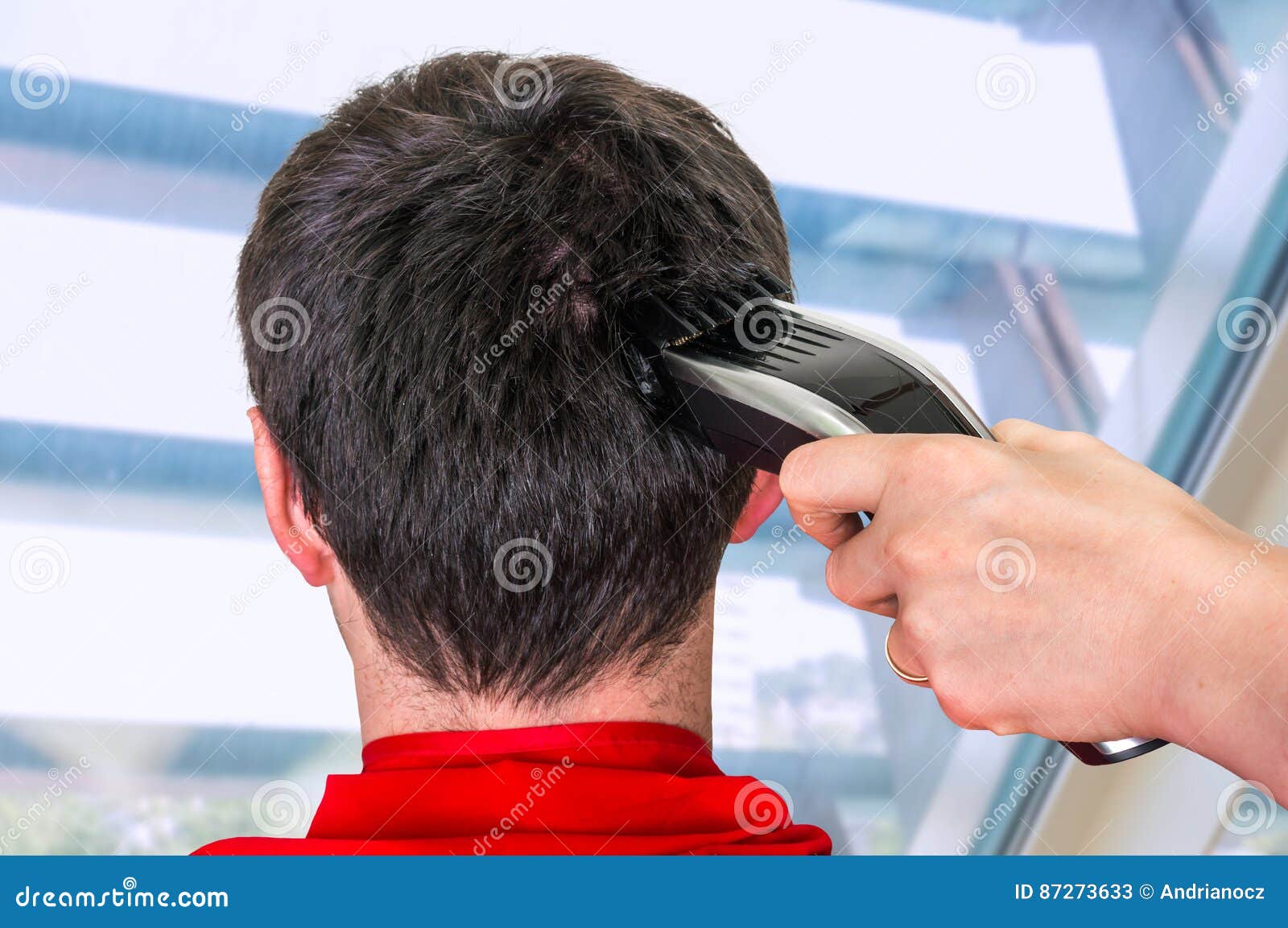 cutting hair with electric clippers