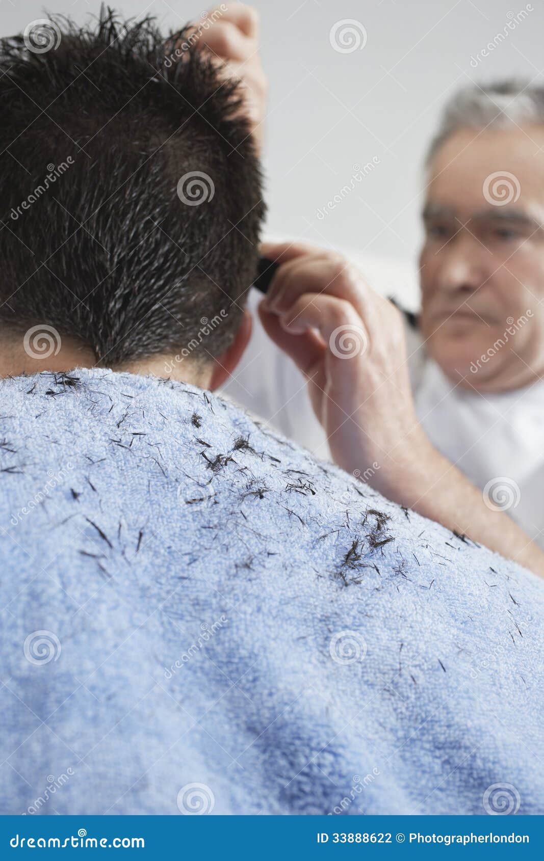 Hairdresser Cutting Man's Hair Stock Photo - Image: 33888622