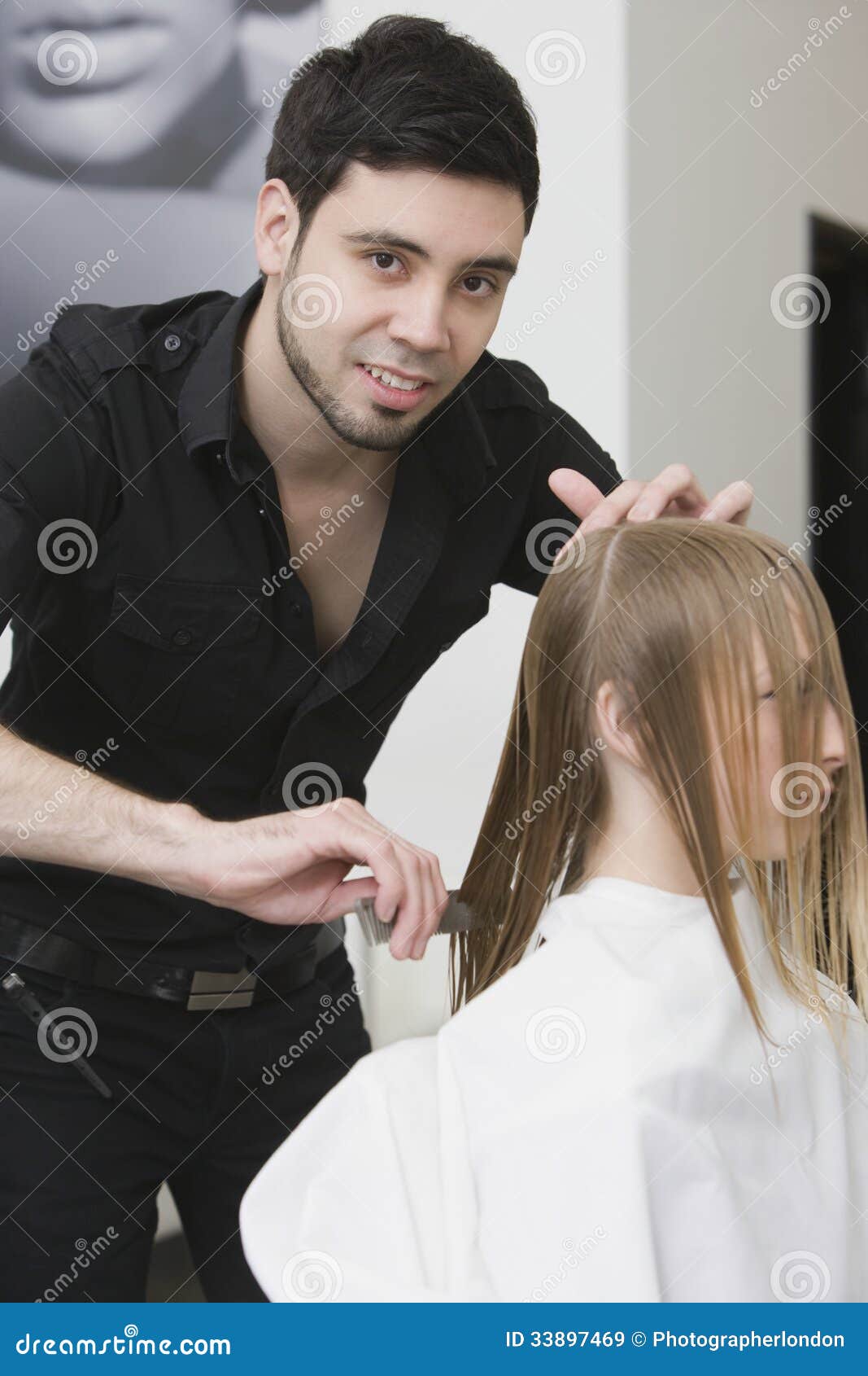 Hairdresser Dividing Client S Hair Before Haircut At Salon 