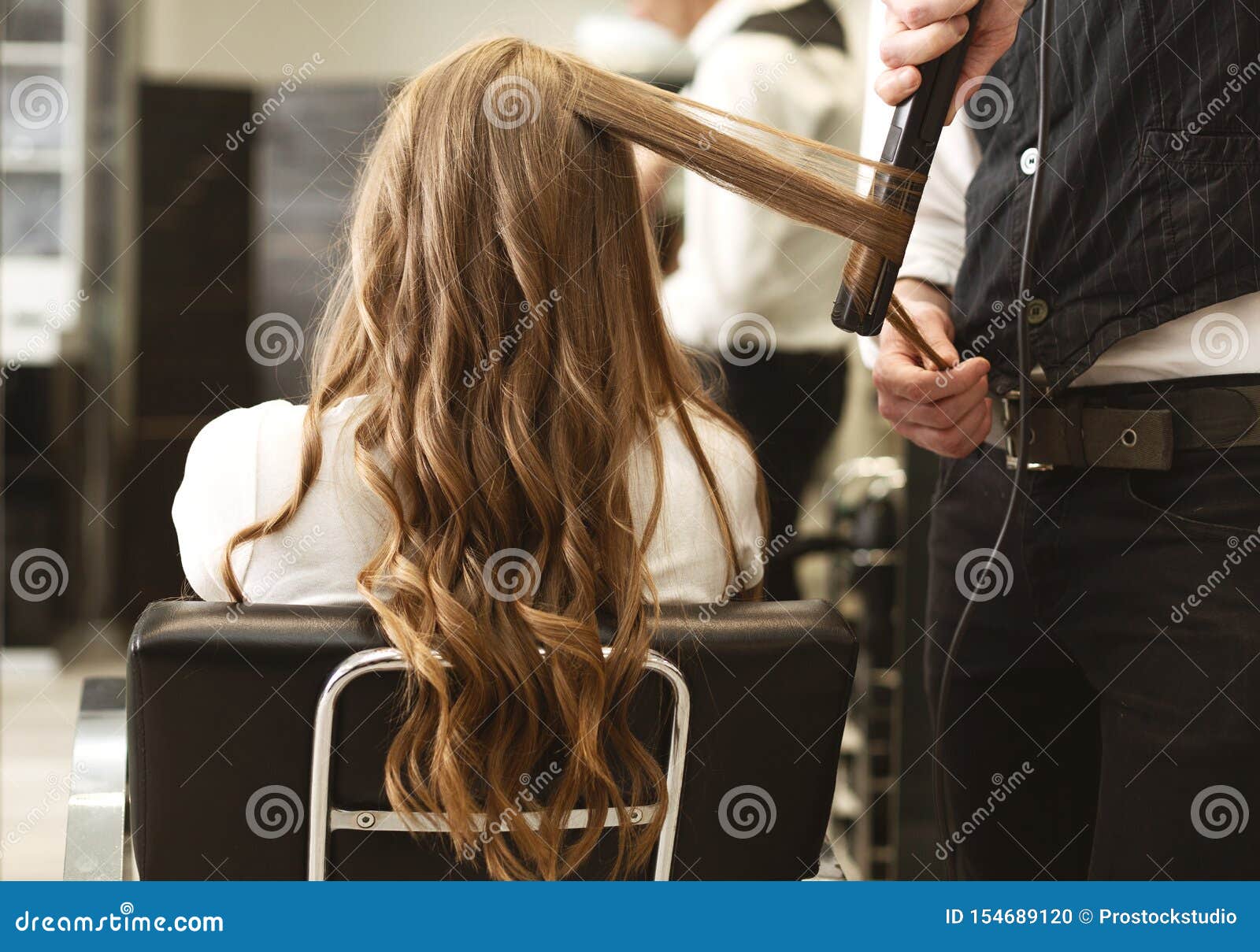 Hairdresser Making Curls with Straightener To Client`s Hair in Salon Stock Photo - Image of long, beauty: 154689120 Hairdresser Making Curls with Straightener To Client`s Hair in Salon Stock Photo - Image of long, beauty: 154689120