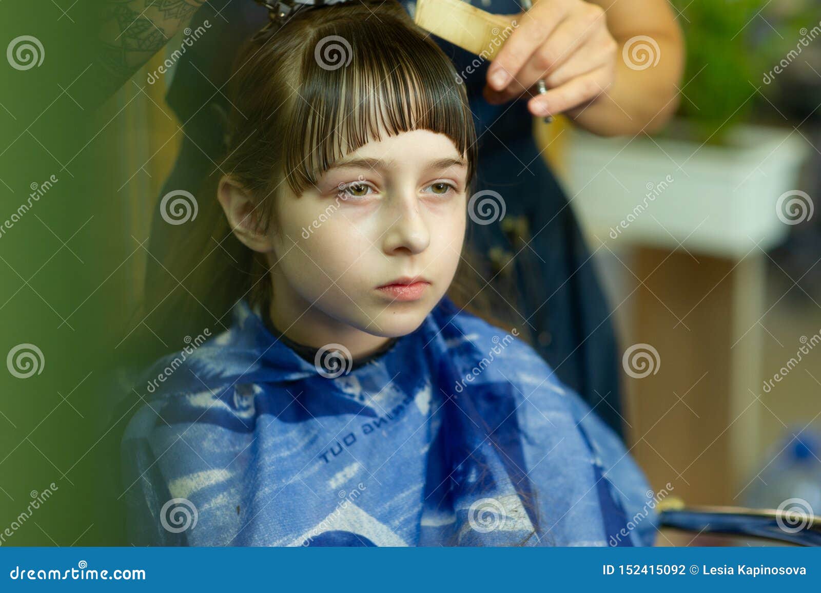 Hairdresser Making A Hair Style To Cute Little Girl Stock