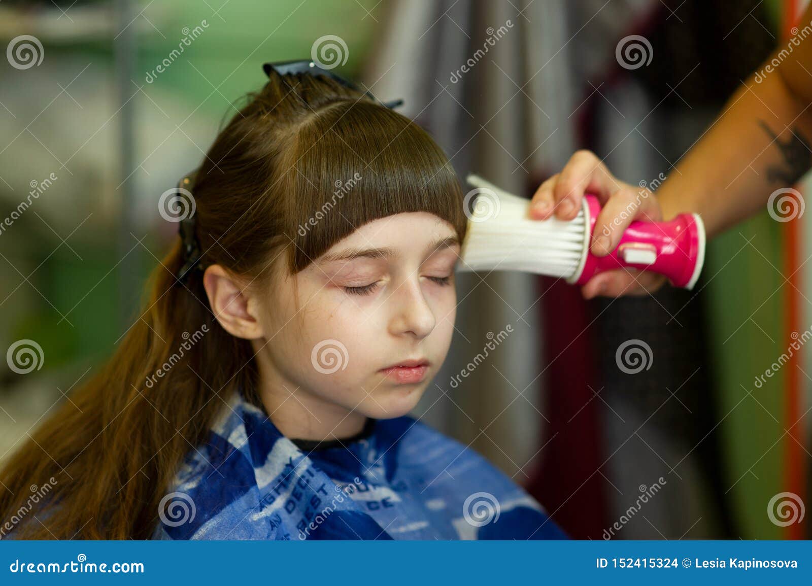 Hairdresser Making A Hair Style To Cute Little Girl Stock