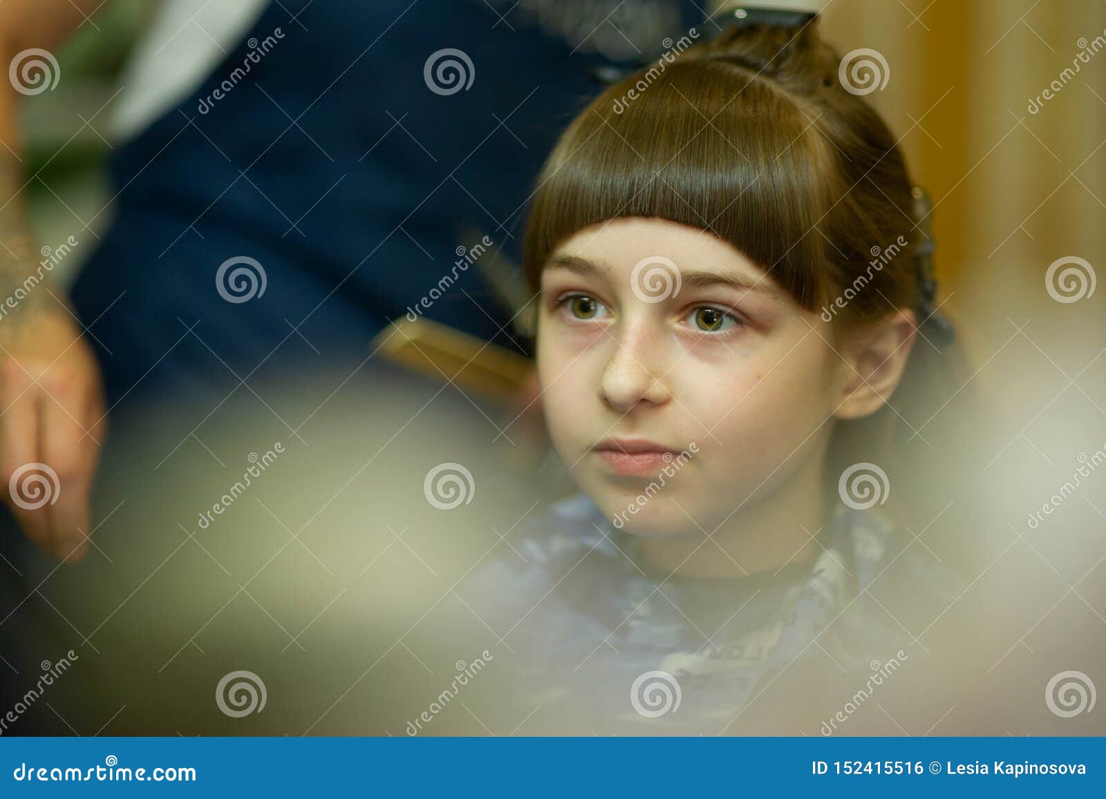 Hairdresser Making A Hair Style To Cute Little Girl Stock