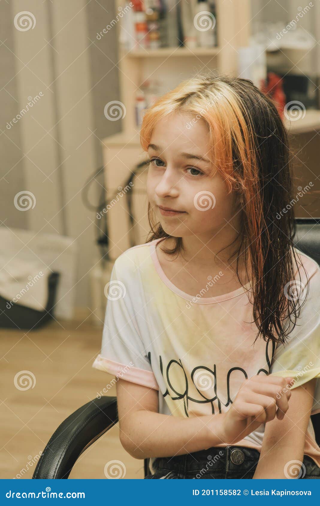 Hairdresser Making a Hair Style To Cute Little Girl. a Teenage Girl Has Her  Bangs Lightened in a Beauty Salon Stock Photo - Image of hairdressing,  salon: 201158582