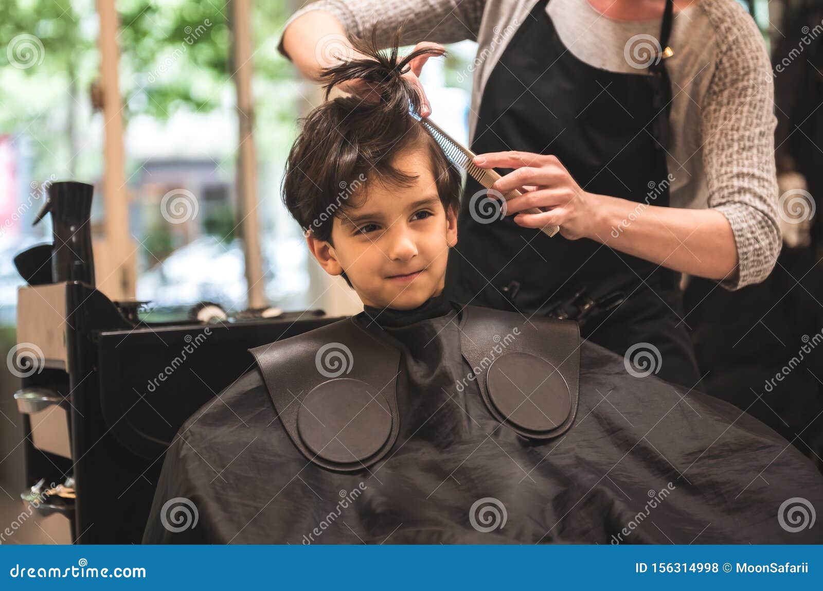 Barbershops put books in hands of kids getting haircuts