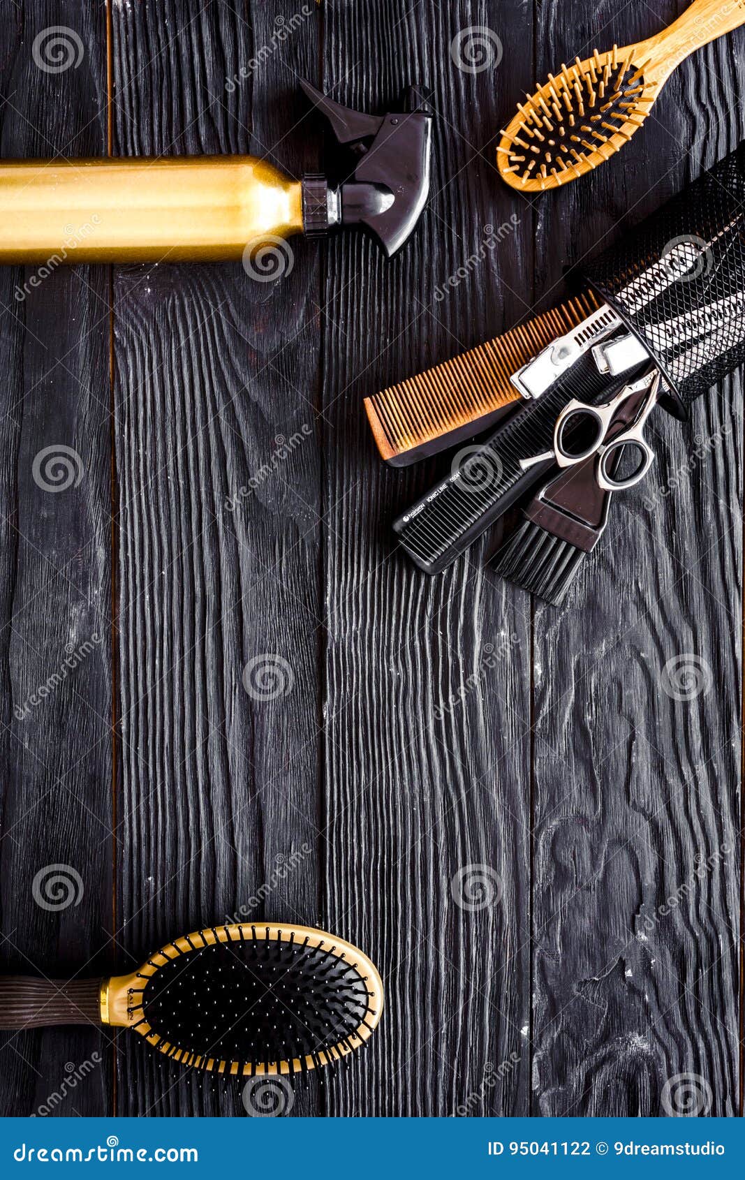 Hairdressing tools on grey wooden background top view space for text. Hairdressing tools on grey wooden background top view.