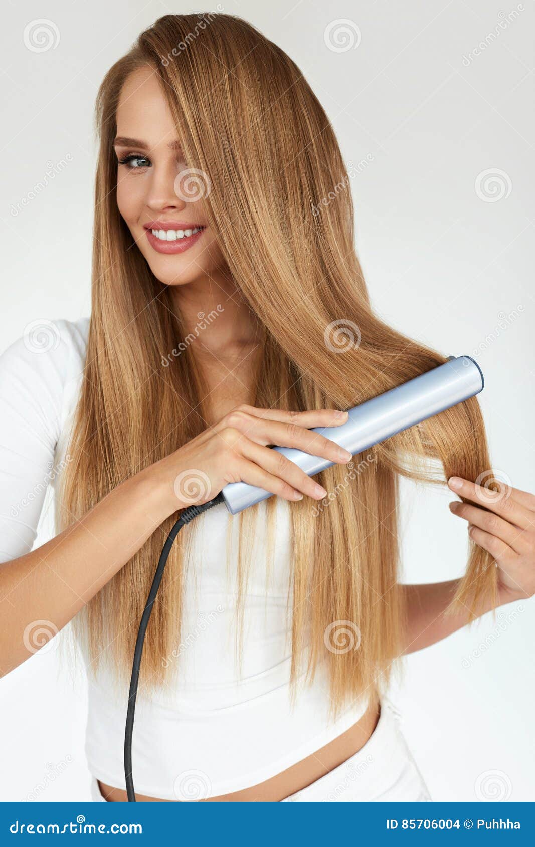 Hairdressing Woman With Beautiful Long Hair Using