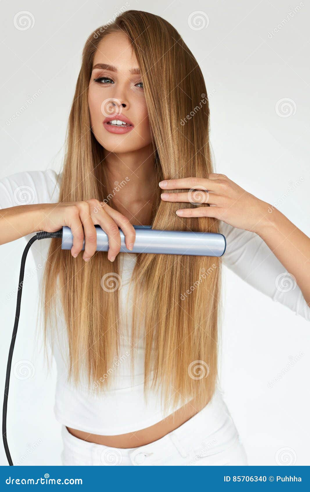 Hairdressing. Woman with Beautiful Long Hair Using Straightener Stock Photo - Image of lifestyle, indoors: 85706340 Hairdressing. Woman with Beautiful Long Hair Using Straightener Stock Photo - Image of lifestyle, indoors: 85706340