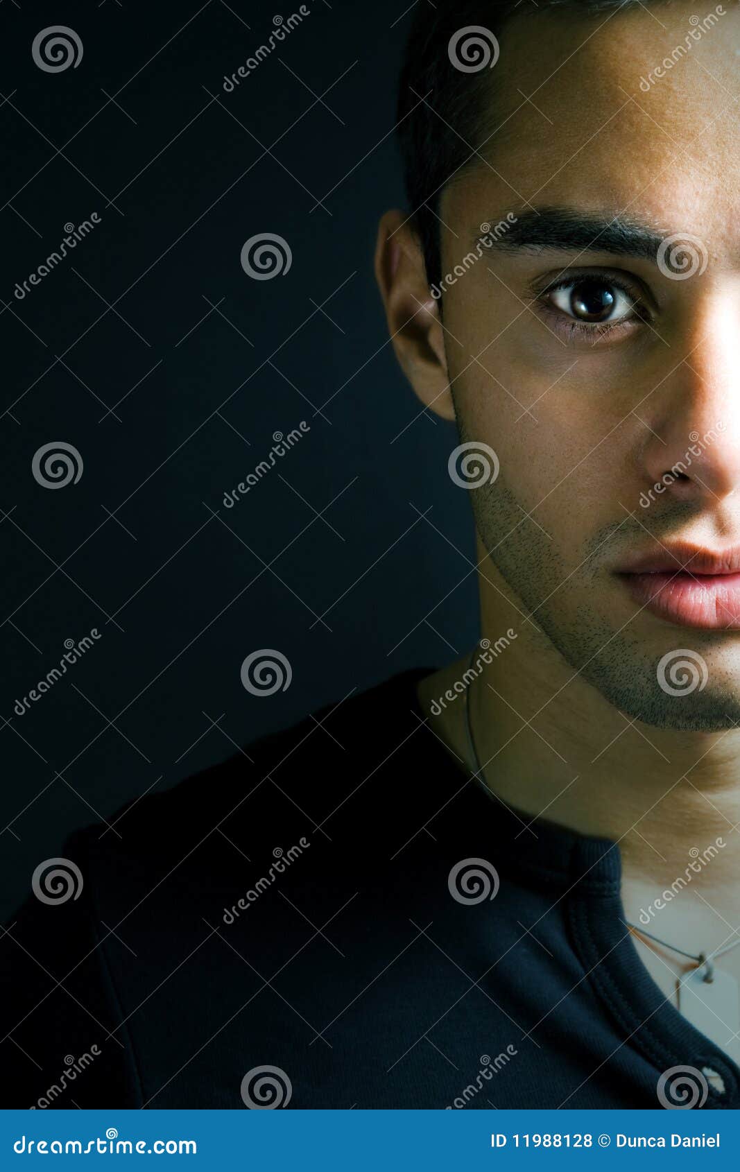 Half Face Portrait Of One Serious Young Man Royalty Free Stock Photos