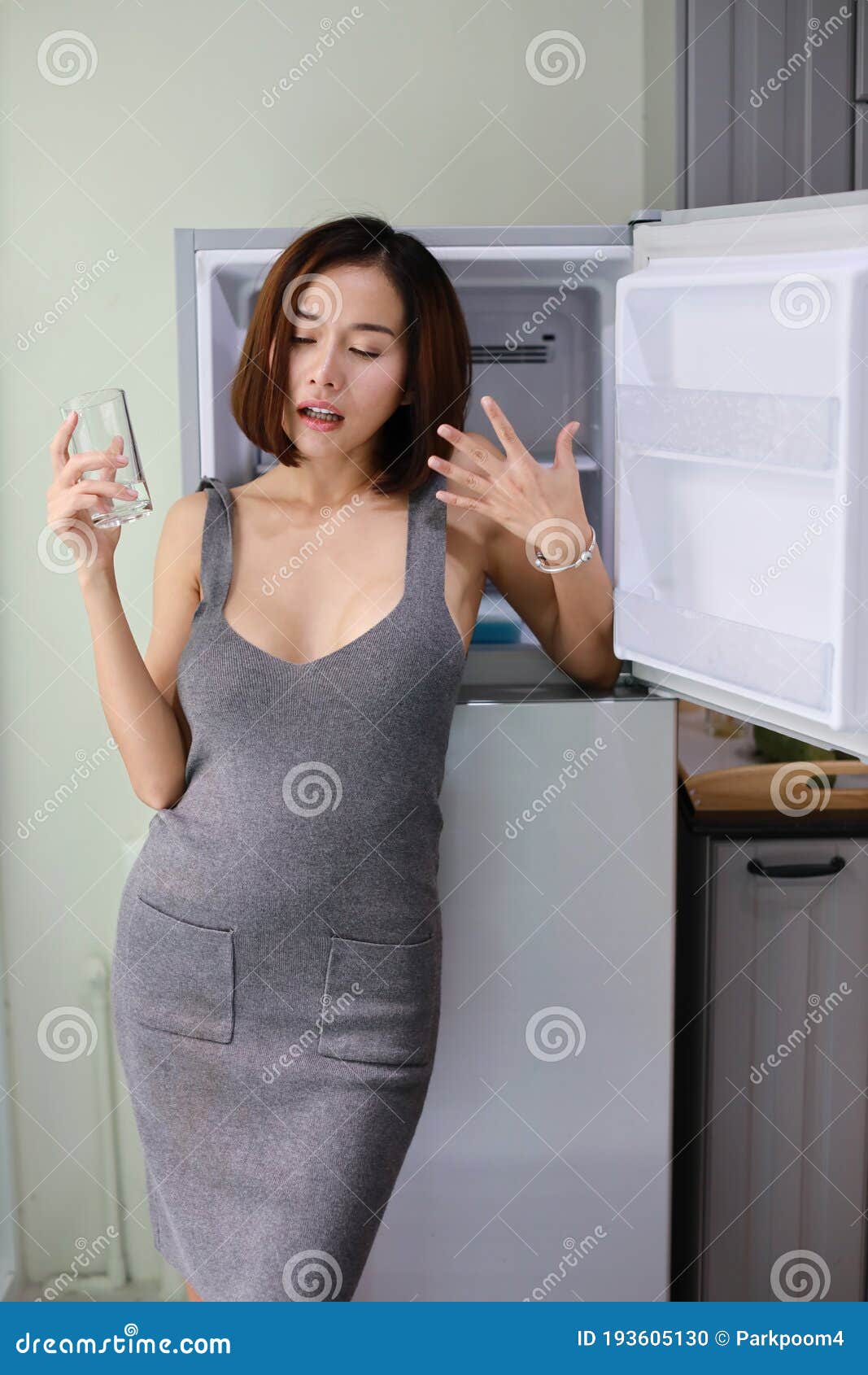 https://thumbs.dreamstime.com/z/half-length-attractive-stunning-asian-woman-short-hair-wife-grey-sexy-dress-no-bra-standing-taking-rest-drinking-193605130.jpg