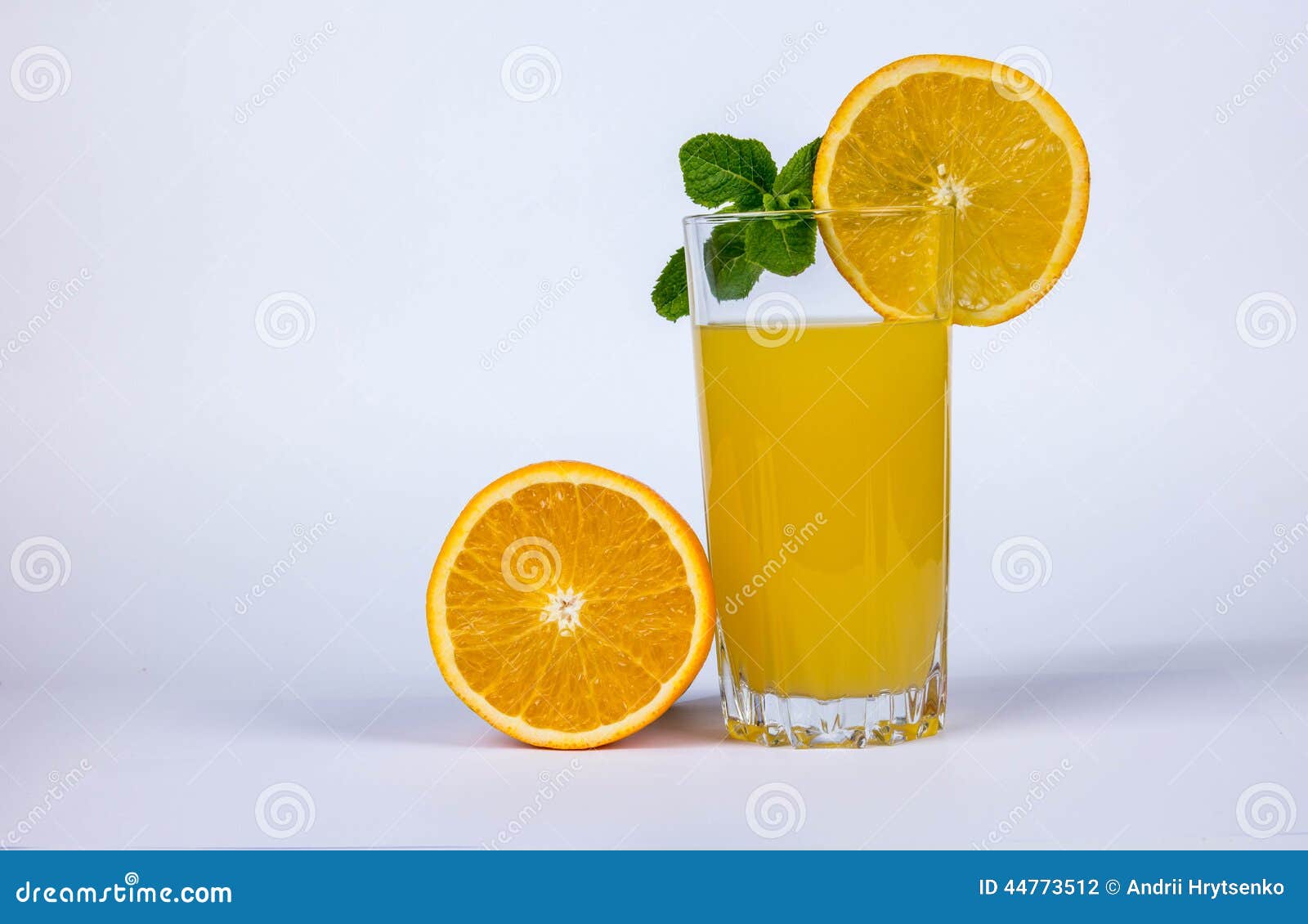 Half of orange and juice stock photo. Image of leaves 44773512