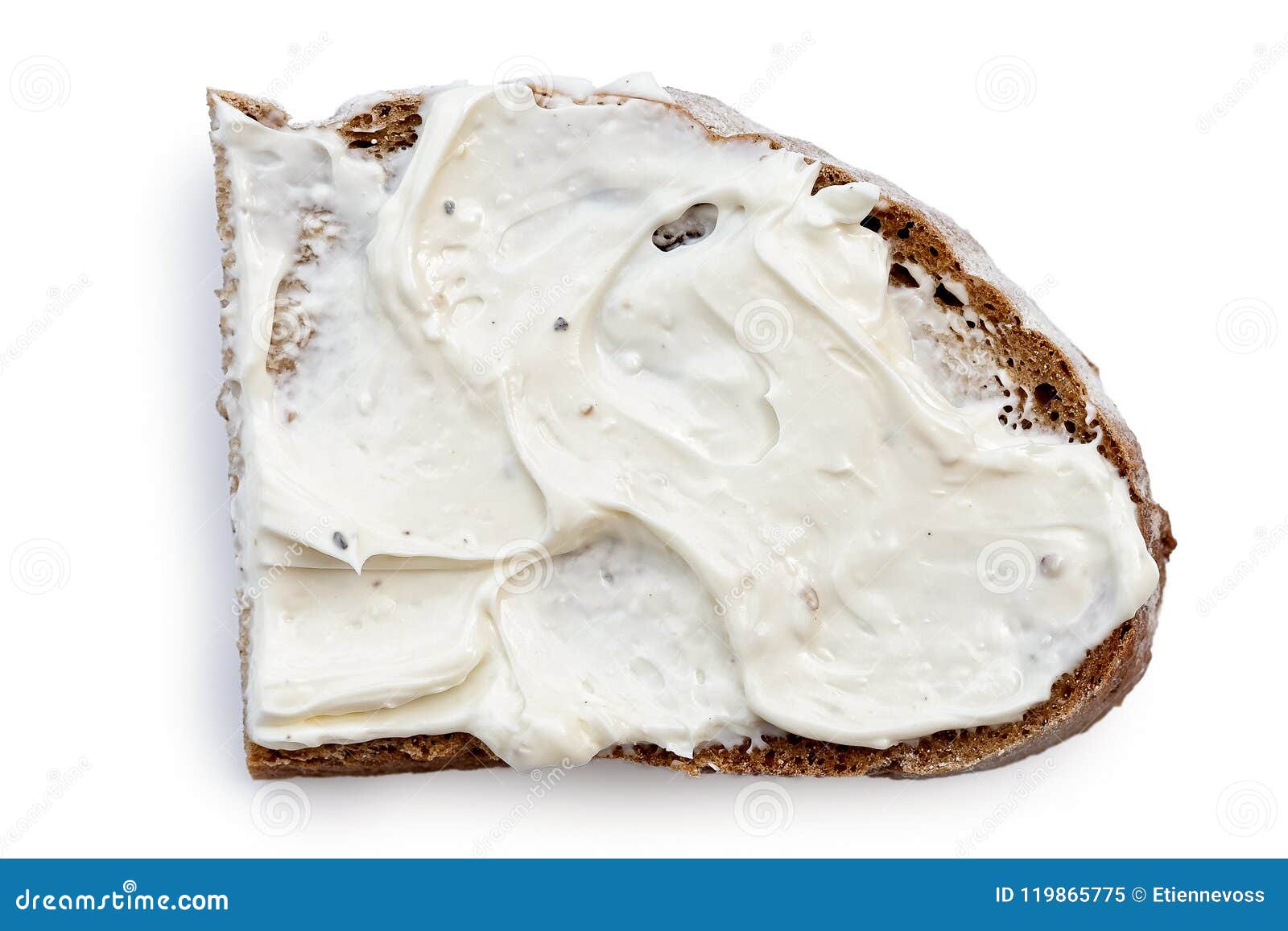 half slice of rye bread with cream cheese spread  on white from above.