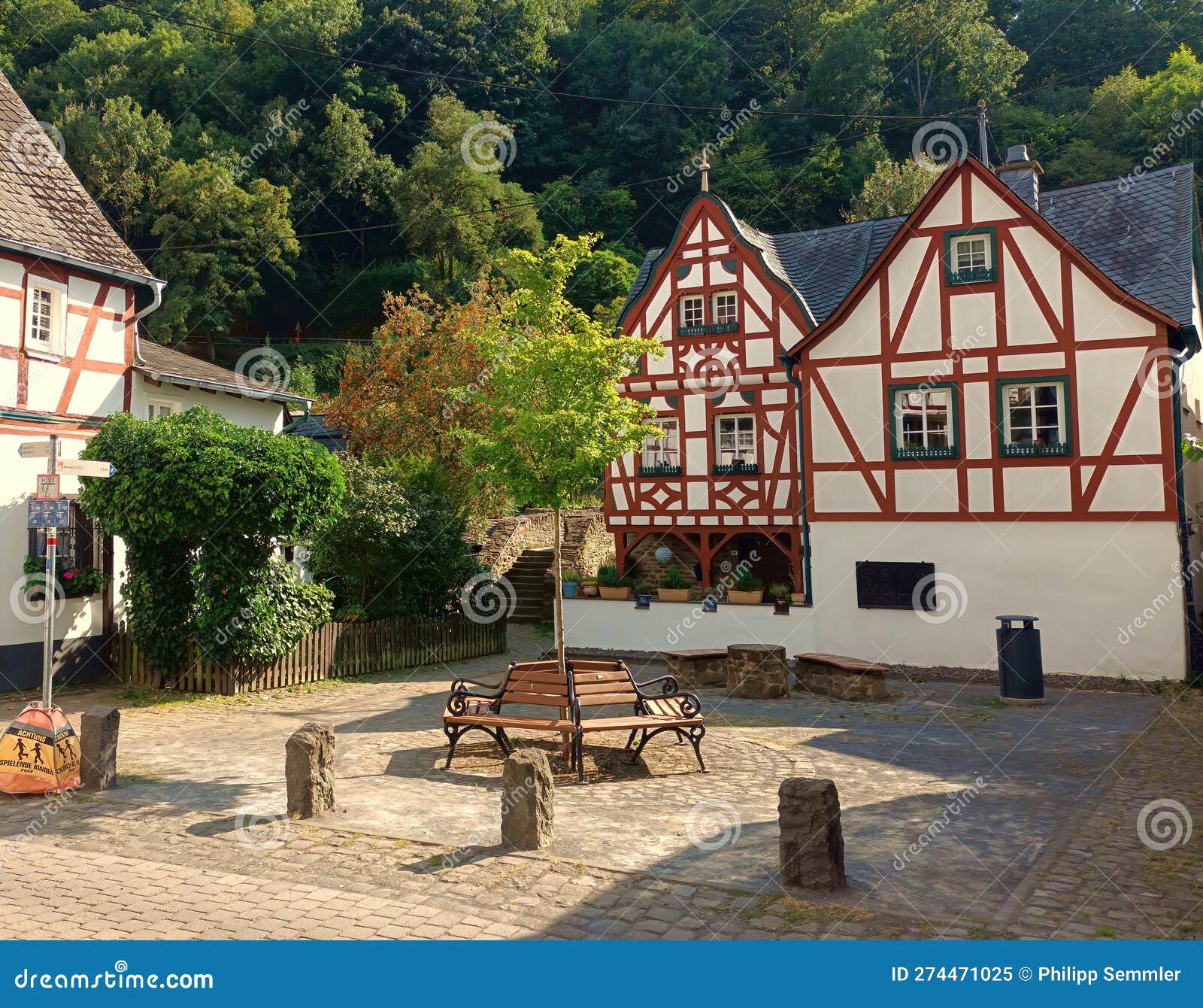 half timbered houses and a bench in village monreal in german region eifel