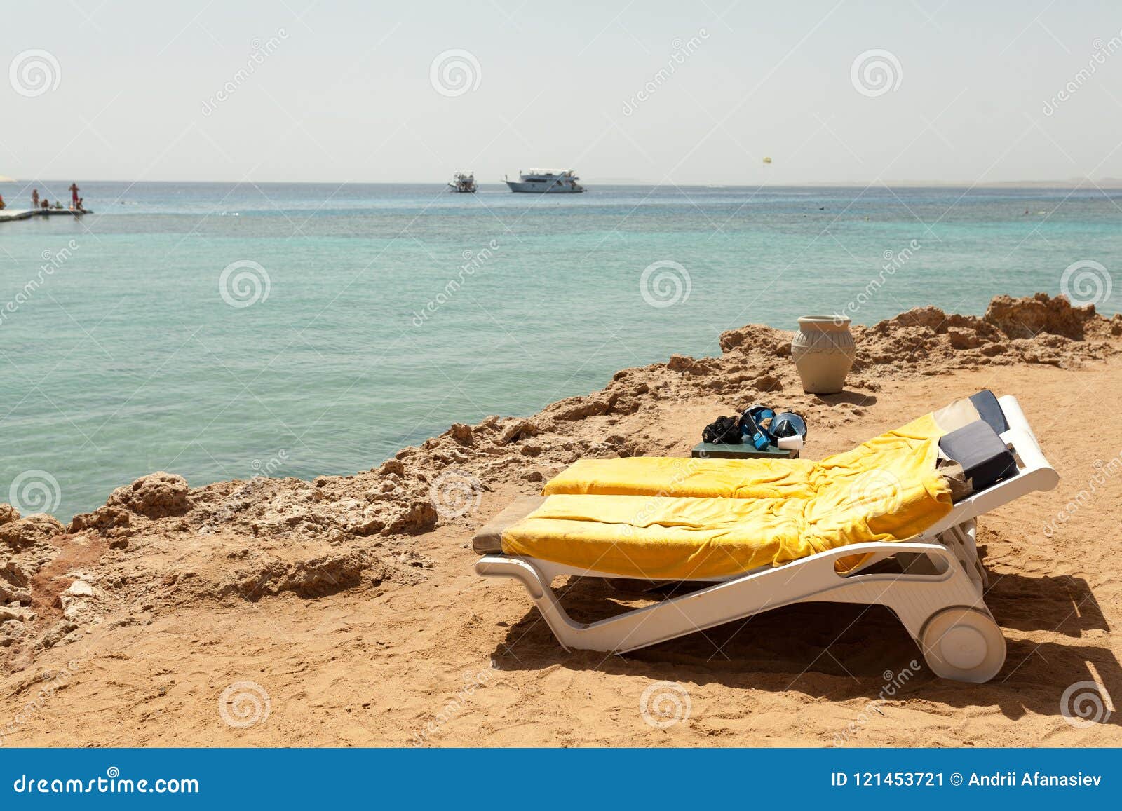 Half Turn View Chaise Longues on the Beach Beach Chaise Longues Stock
