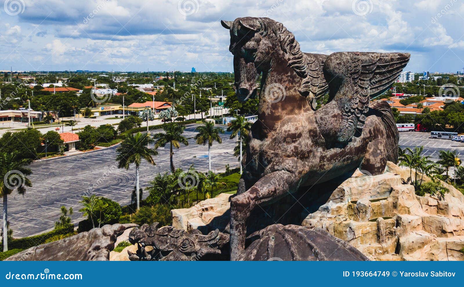 Hallandale Beach, Florida, USA - August 16, 2020: Aerial view on 30 meters statue of a Pegasus and Dragon at Gulfstream Park in Hallandale Beach, Florida. A pegasus is depicted defeating a dragon.