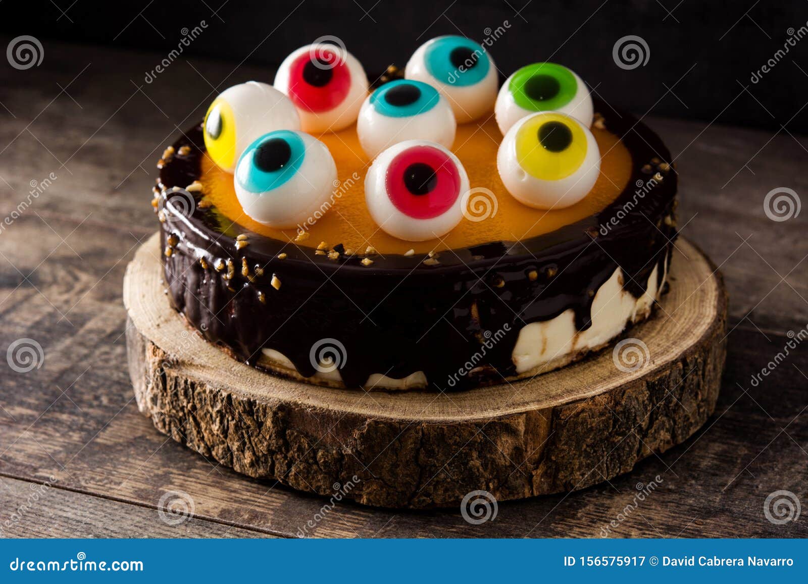 Halloween Cake with Candy Eyes Decoration on Wood Stock Image - Image ...