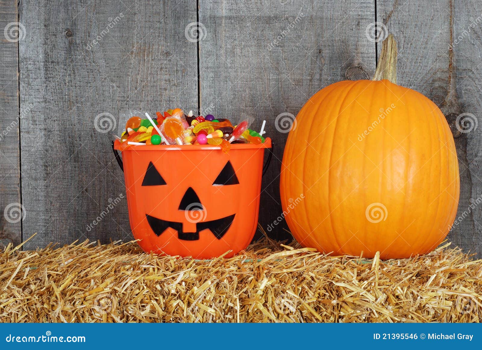 Halloween Candy in Pumpkin Bucket Stock Photo - Image of barn, harvest ...