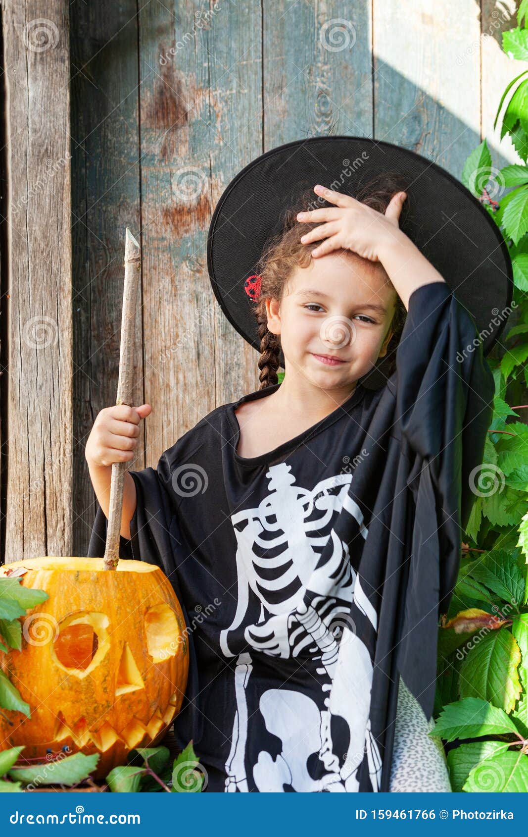 Download Little Witch With Halloween Pumpkin Stock Photo - Image of ...