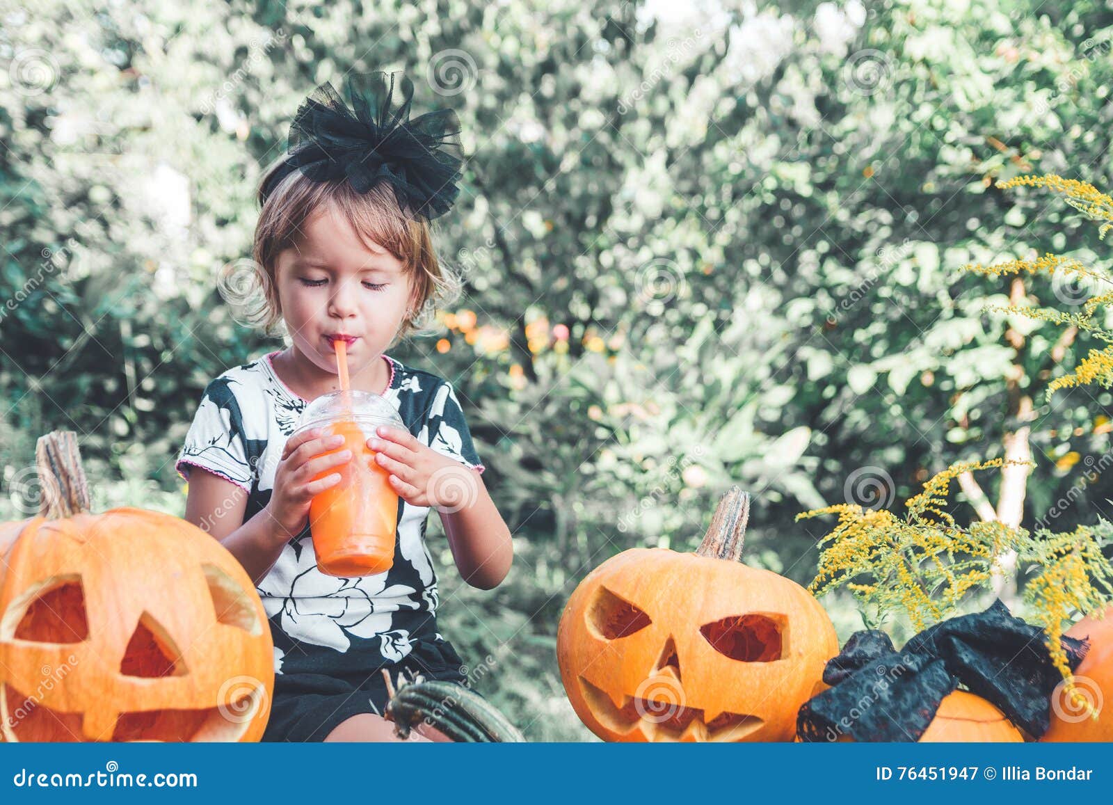 Halloween. Child Dressed in Black Drinking Pumpkin Cocktail, Trick or ...