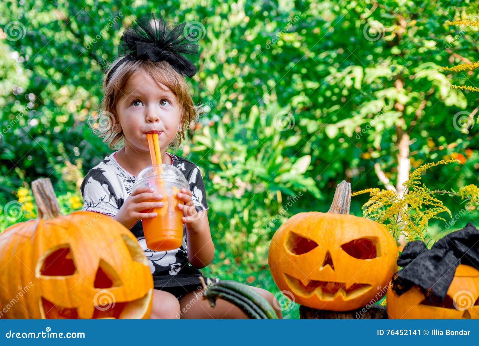 Halloween. Child Dressed in Black Drinking Pumpkin Cocktail, Trick or ...