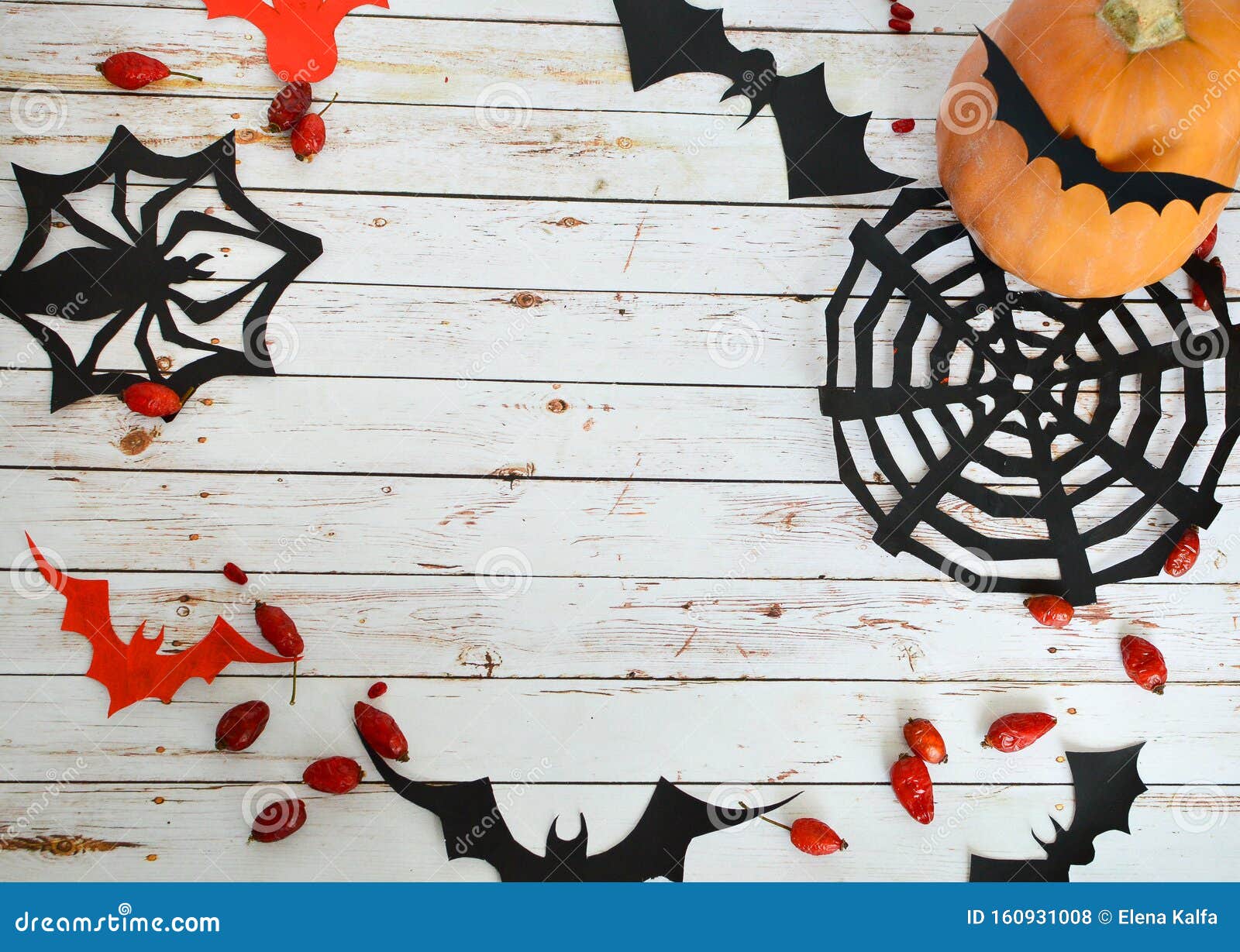 Halloween Decorations on a White Wooden Background: Pumpkin ...