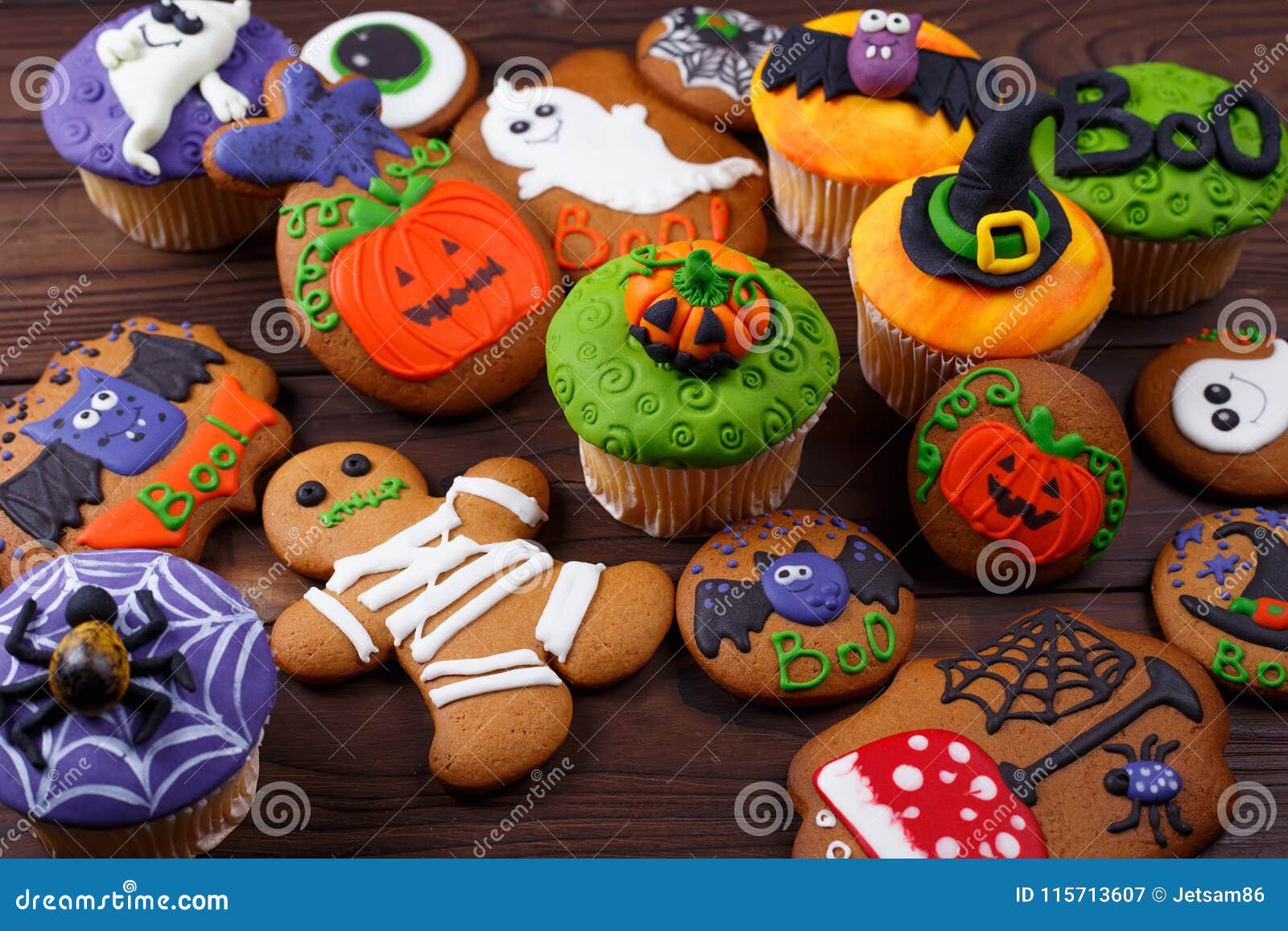 halloween homemade gingerbread cookies and cupcakes background.