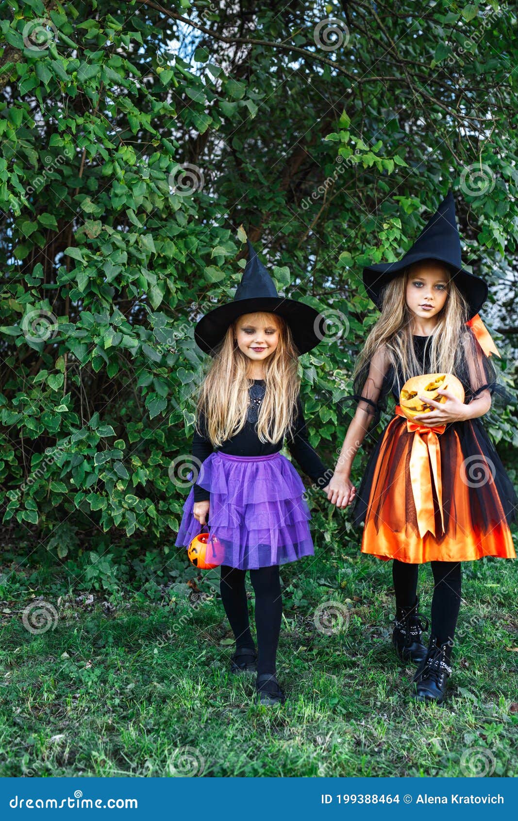 Halloween Little Girls in Witch Costume Out for Trick-or-treating Stock ...