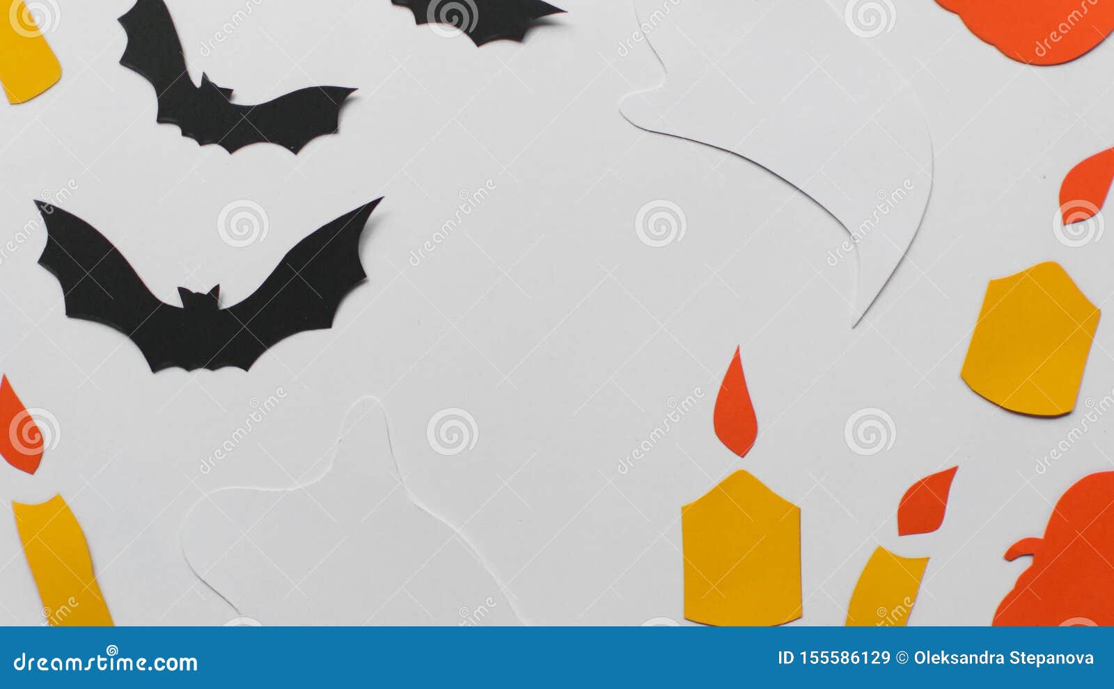 halloween with paper pumpkins, bats, candles. flat lay
