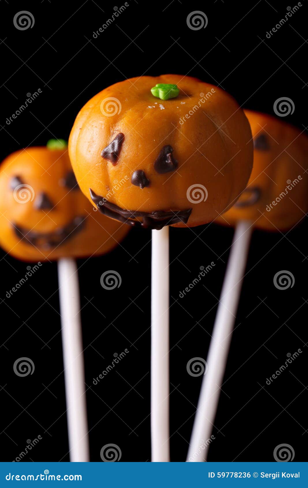 Halloween Pumpkin Cake Pops Isolated on a Black. Vertical Stock Photo ...