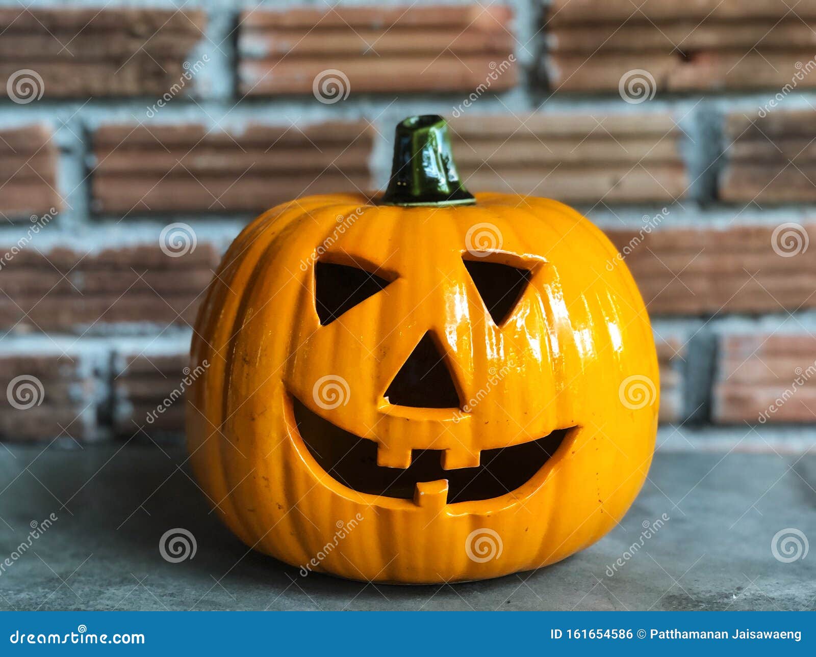 Halloween Pumpkin on the Cement Floor with Orange Brick and Dark Light ...