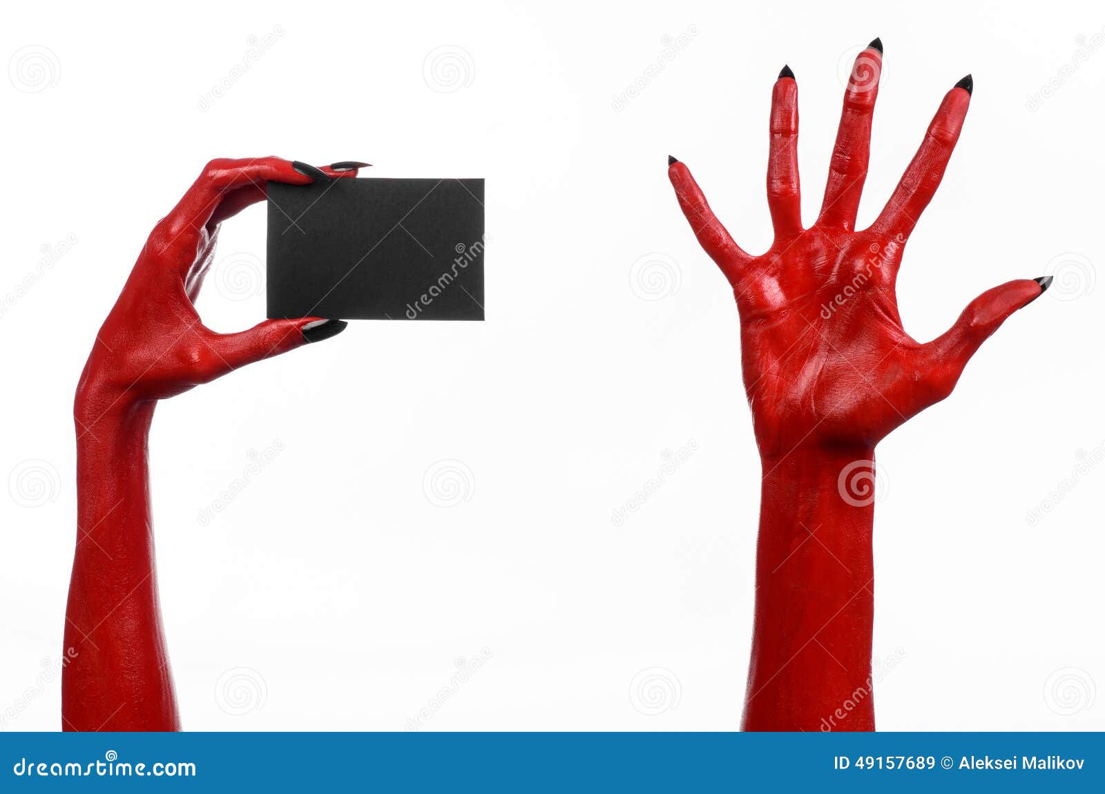 Halloween Theme: Red Devil Hand With Black Nails Holding A ...
