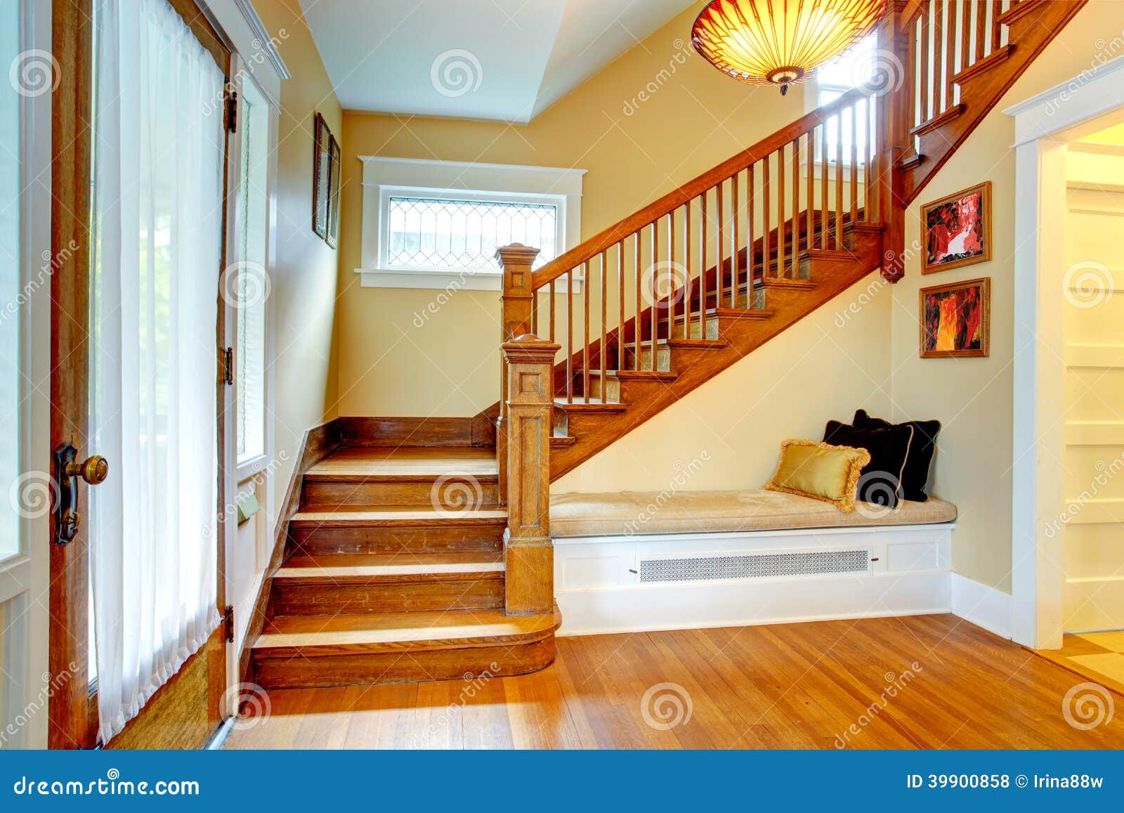 hallway interior. old staircase with bench