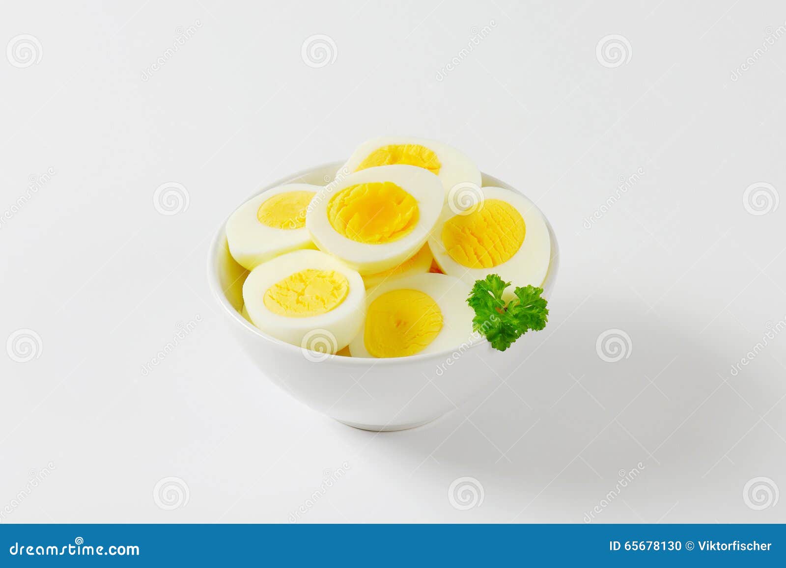 Halved hard boiled eggs stock photo. Image of food, shot 65678130