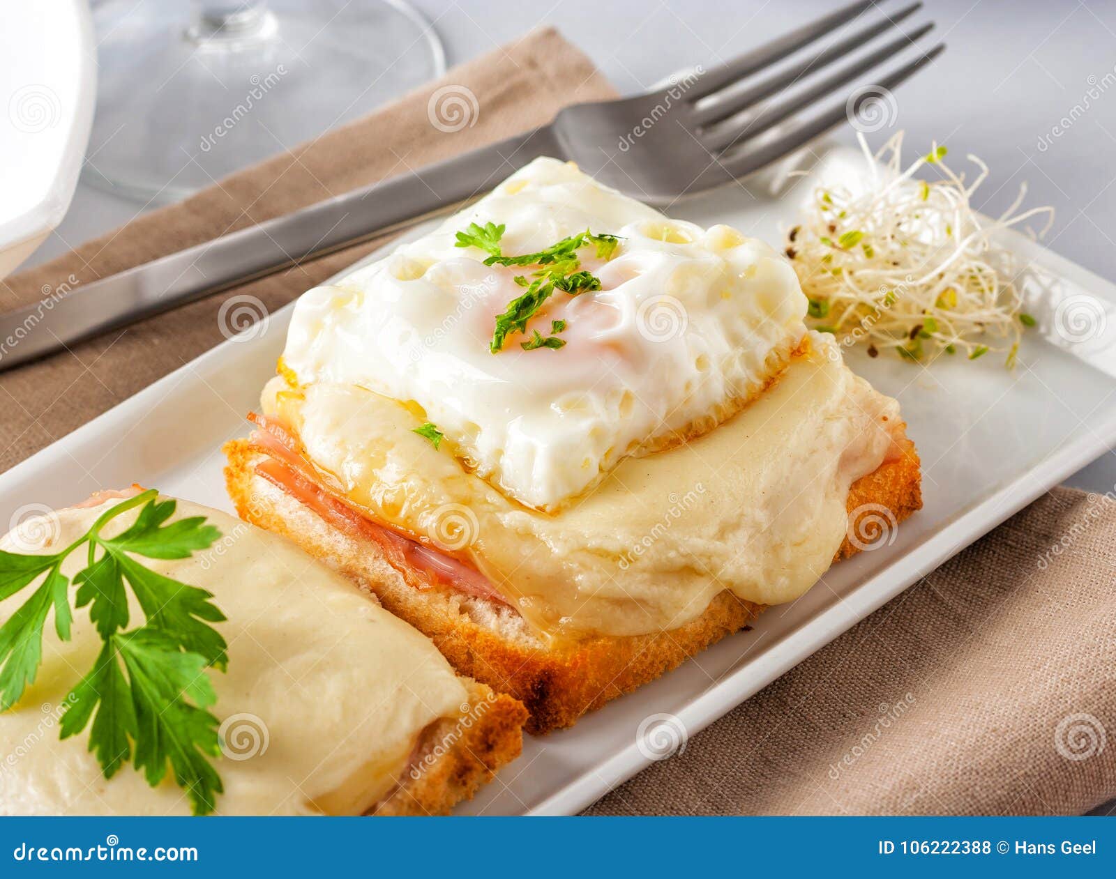 Ham and Cheese Sandwich with Melted Cheese and Fried Egg Stock Photo