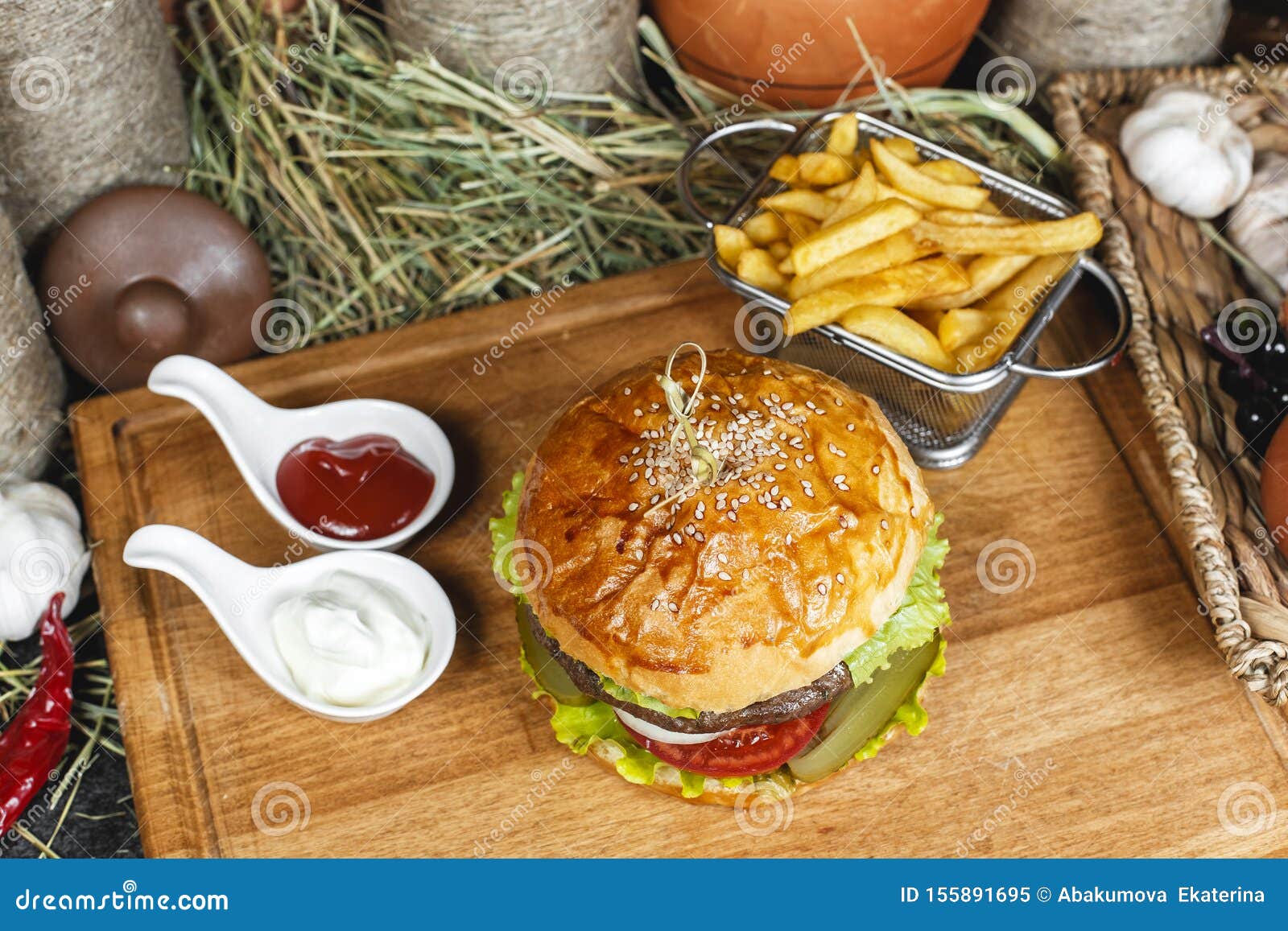Hamburger With French Fries Ketchup And Creamy Sauce In Oriental Style