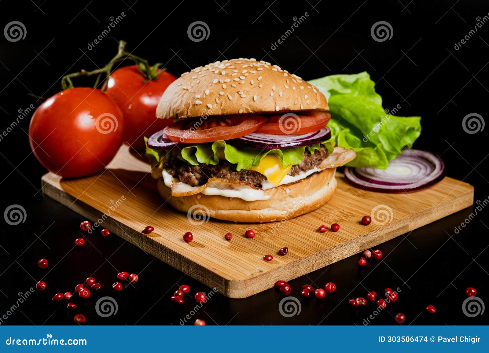 Hamburger with Meat Patty and Cheese. Bacon and Fresh Vegetables Stock