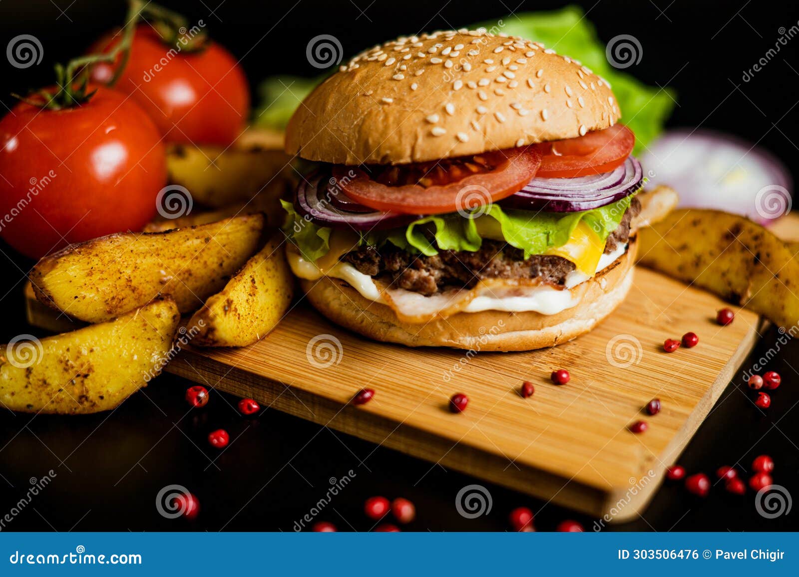 Hamburger with Meat Patty and Cheese. Bacon and Fresh Vegetables Stock