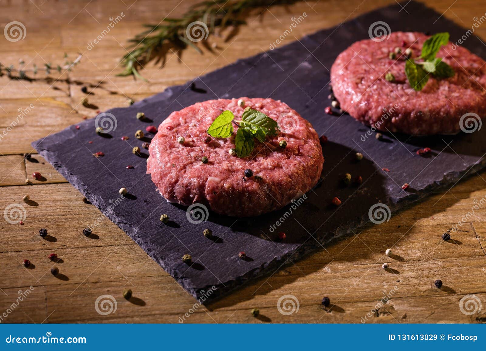 hamburguer meat on slate dish