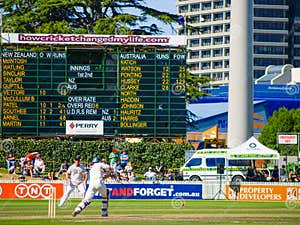 Australia Versus New Zealand In Cricket Game With Score Board And Team 