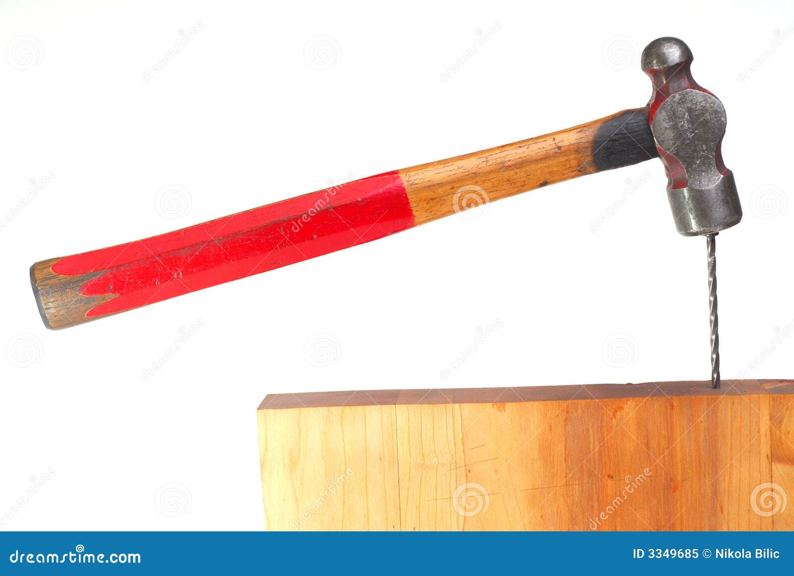 Hammer just hit nail isolated on white background