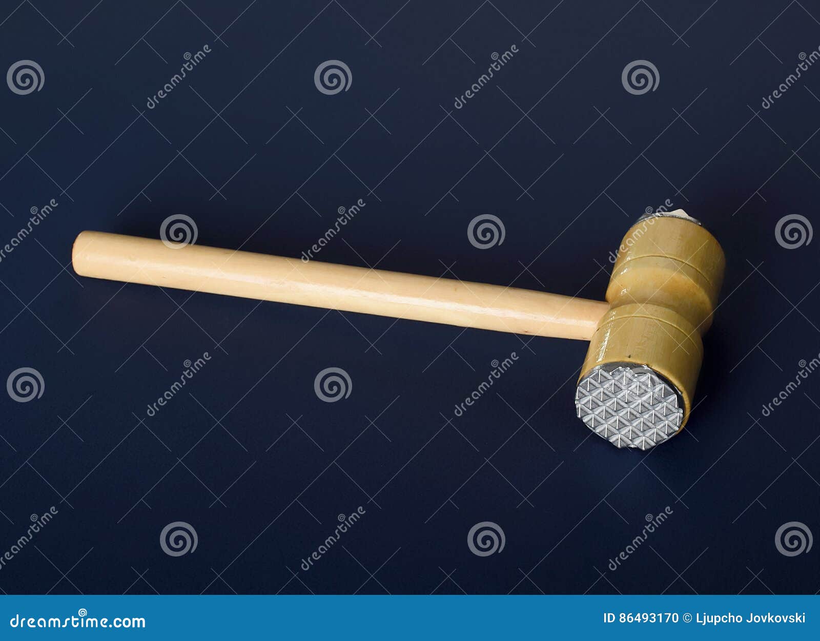 Hammer for Beating the Meat with a Wooden Handle. Stock Photo Image
