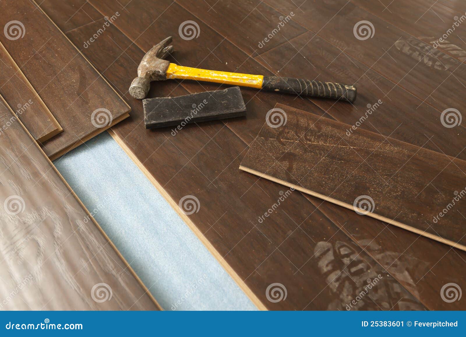Hammer and Block with New Laminate Flooring Stock Image Image of